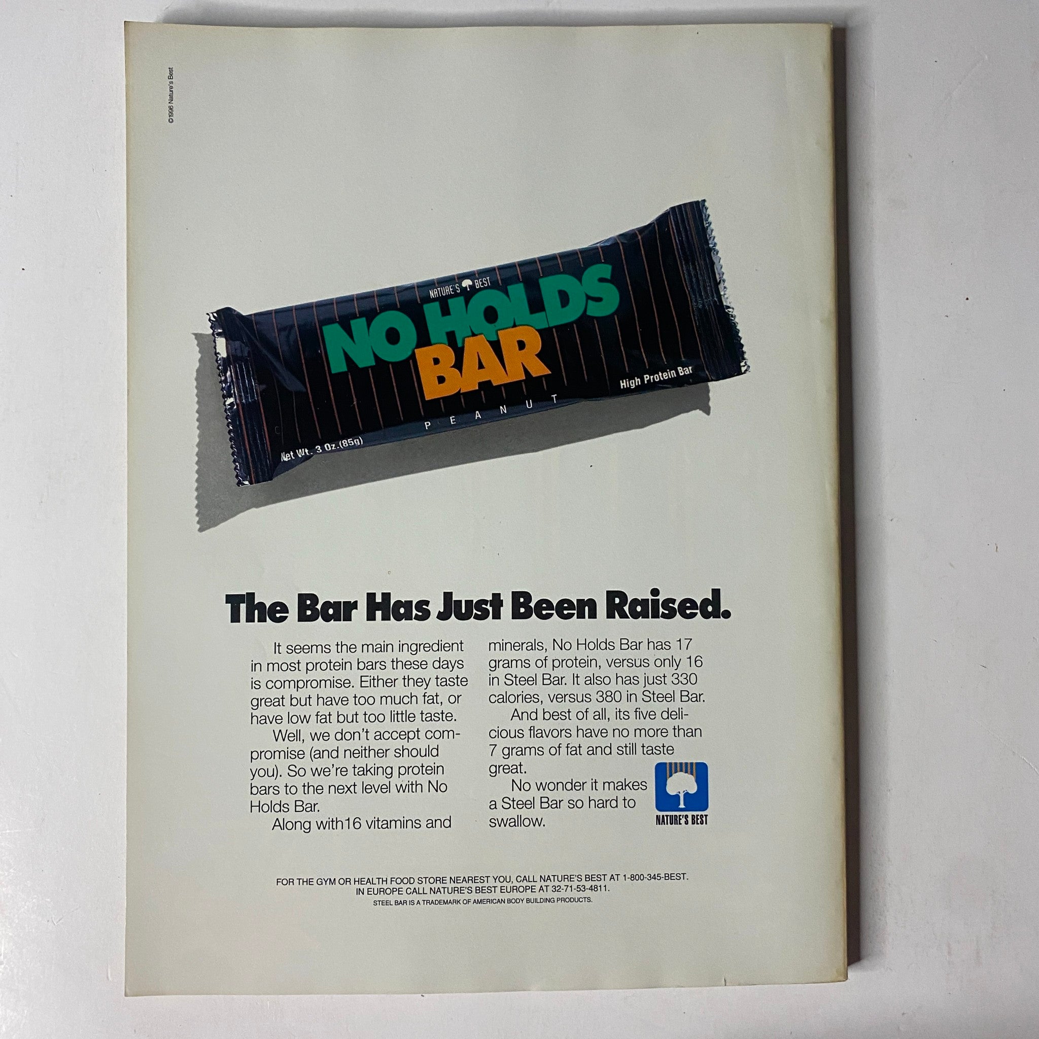 Back cover of MuscleMag International Magazine May 1996 No. 167 featuring an advertisement for No Holds Bar protein snack bar.