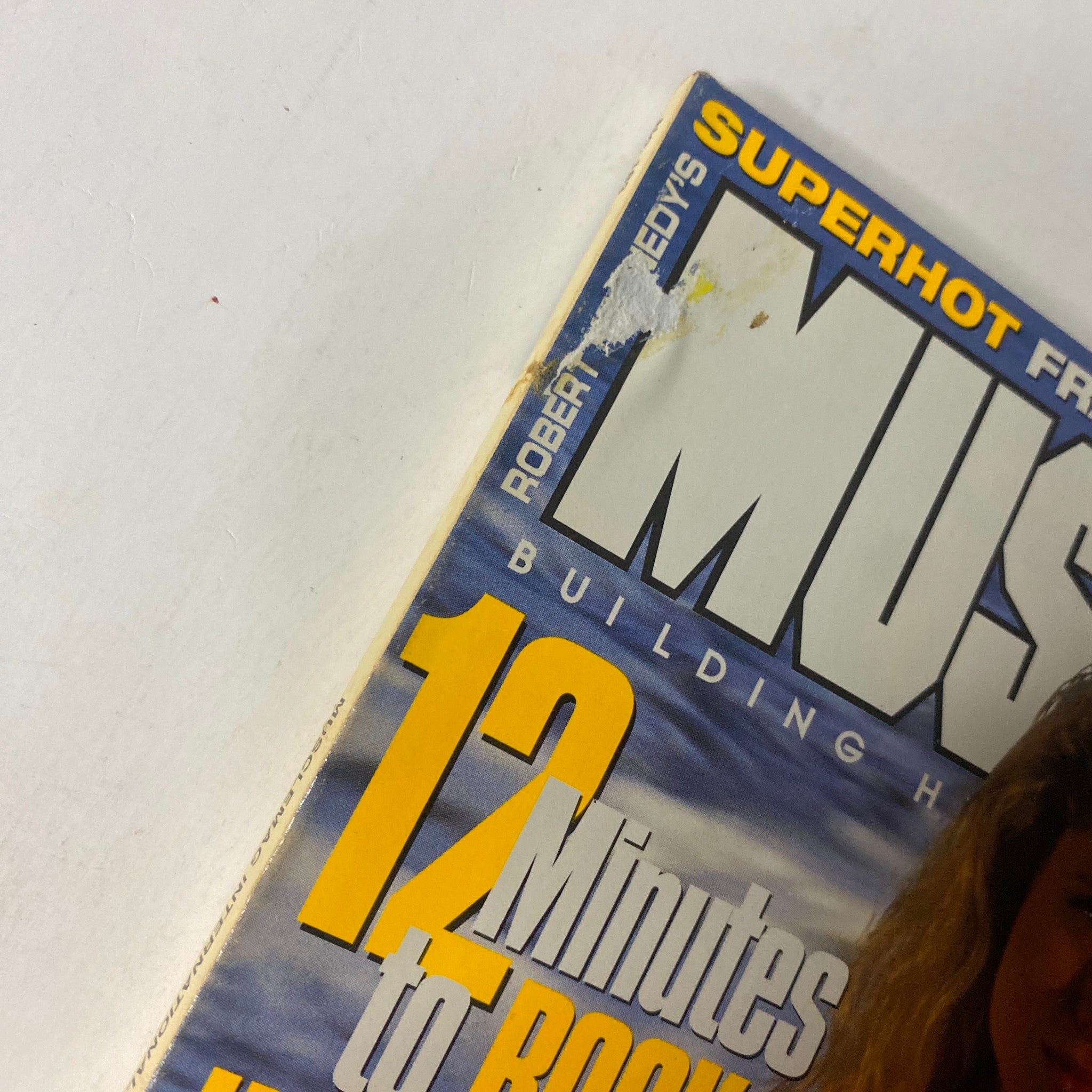 Cover detail of MuscleMag International Magazine September 1997 No. 183 featuring a small imperfection on the edge, representative of the magazine's good condition without a mailing label.