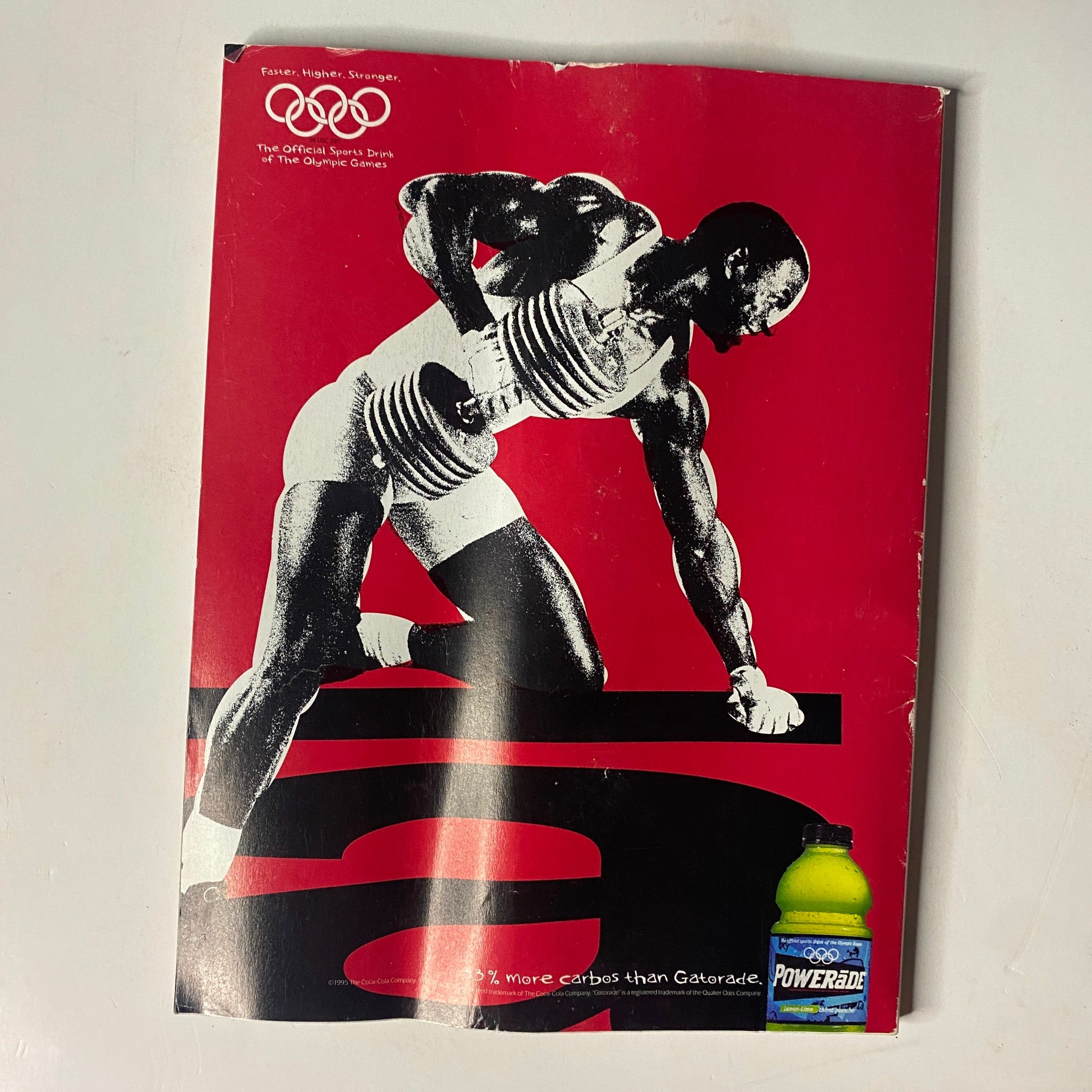 Back cover of Muscle & Fitness Magazine July 1995 Vol 56 No. 7, featuring a marketing image of an athlete using dumbbells, alongside a Powerade advertisement.