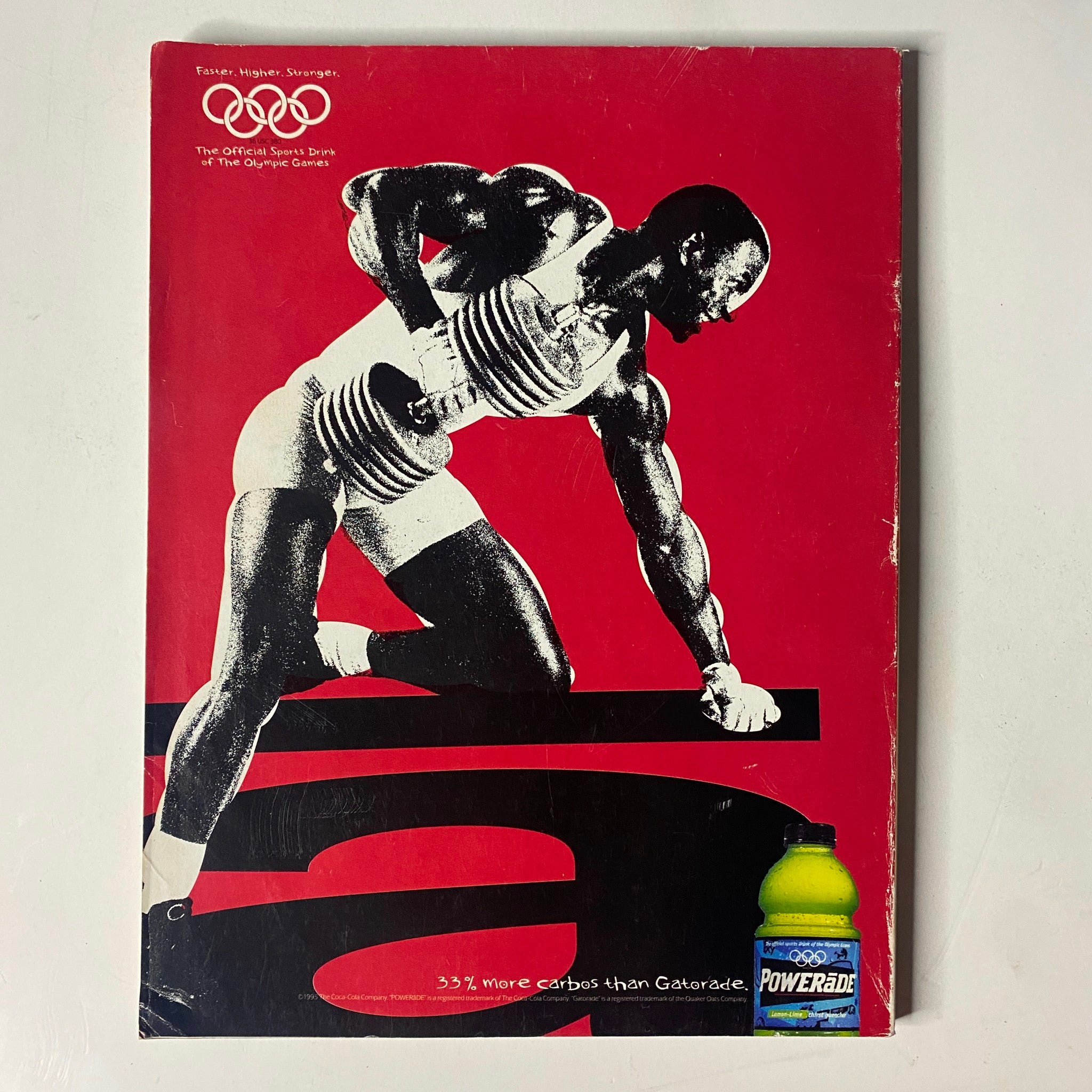 Muscle & Fitness Magazine July 1995 back cover showcasing a muscular athlete with dumbbells against a bold red background, promoting Powerade, emphasizing effective hydration for fitness.