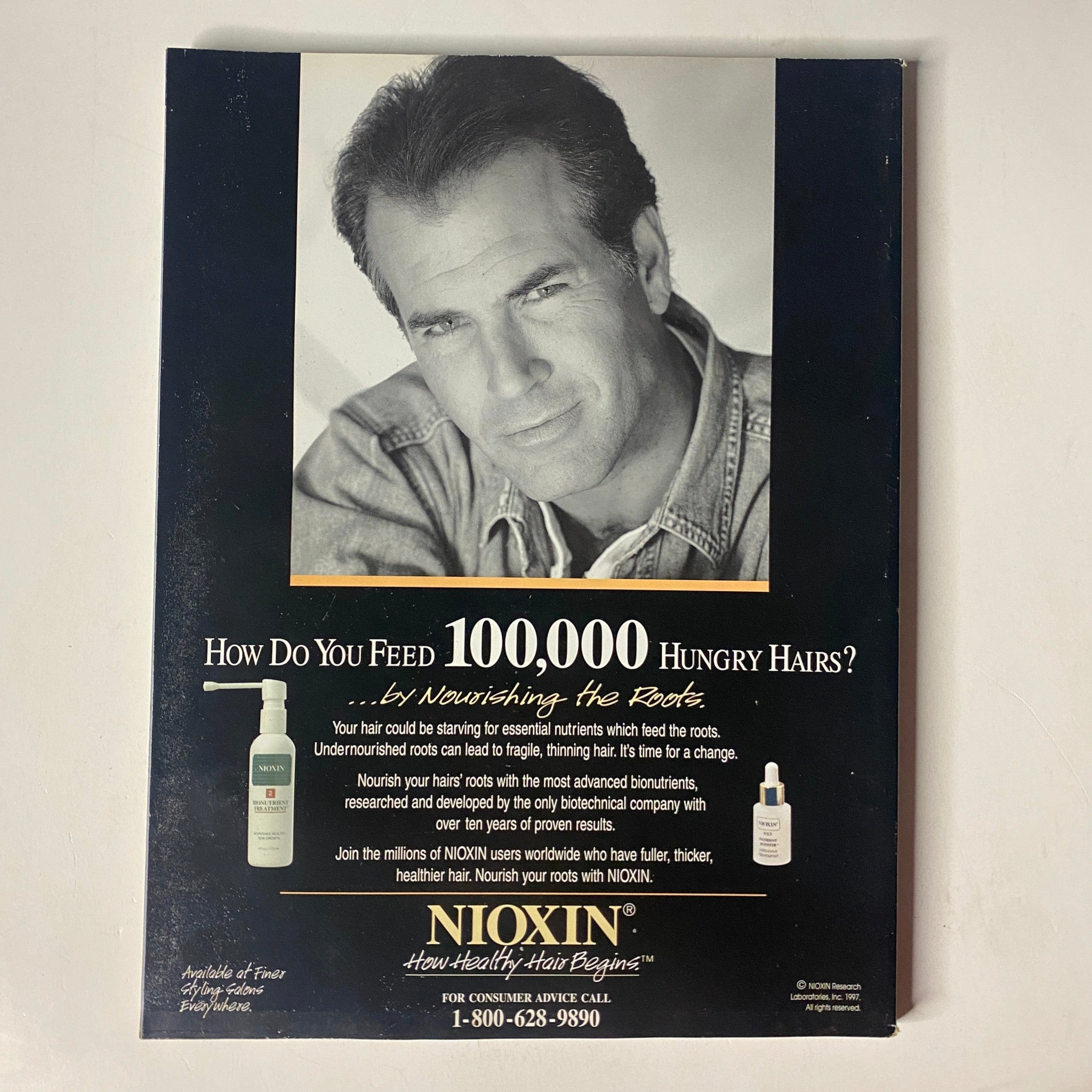 Advertisement page in Muscle & Fitness Magazine February 1997 Vol 58 No. 2 for Nioxin hair care products, promoting nourishment for healthy hair.