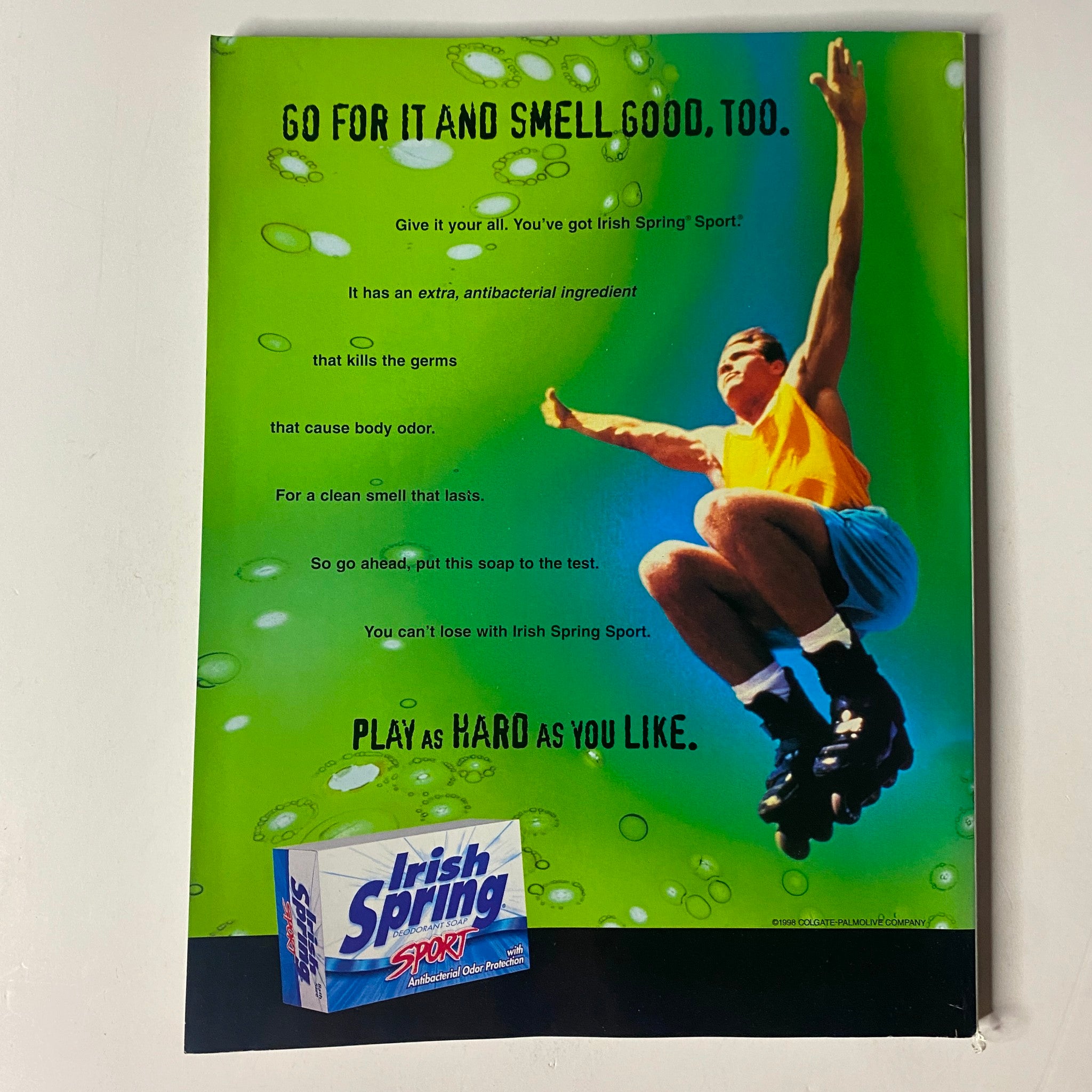 Advertisement for Irish Spring Sport featuring a young man engaging in an active, dynamic pose, promoting its antibacterial properties to combat body odor. Title: Muscle & Fitness Magazine June 1999 Vol 60 No. 6 Cory Everson No Label VG.