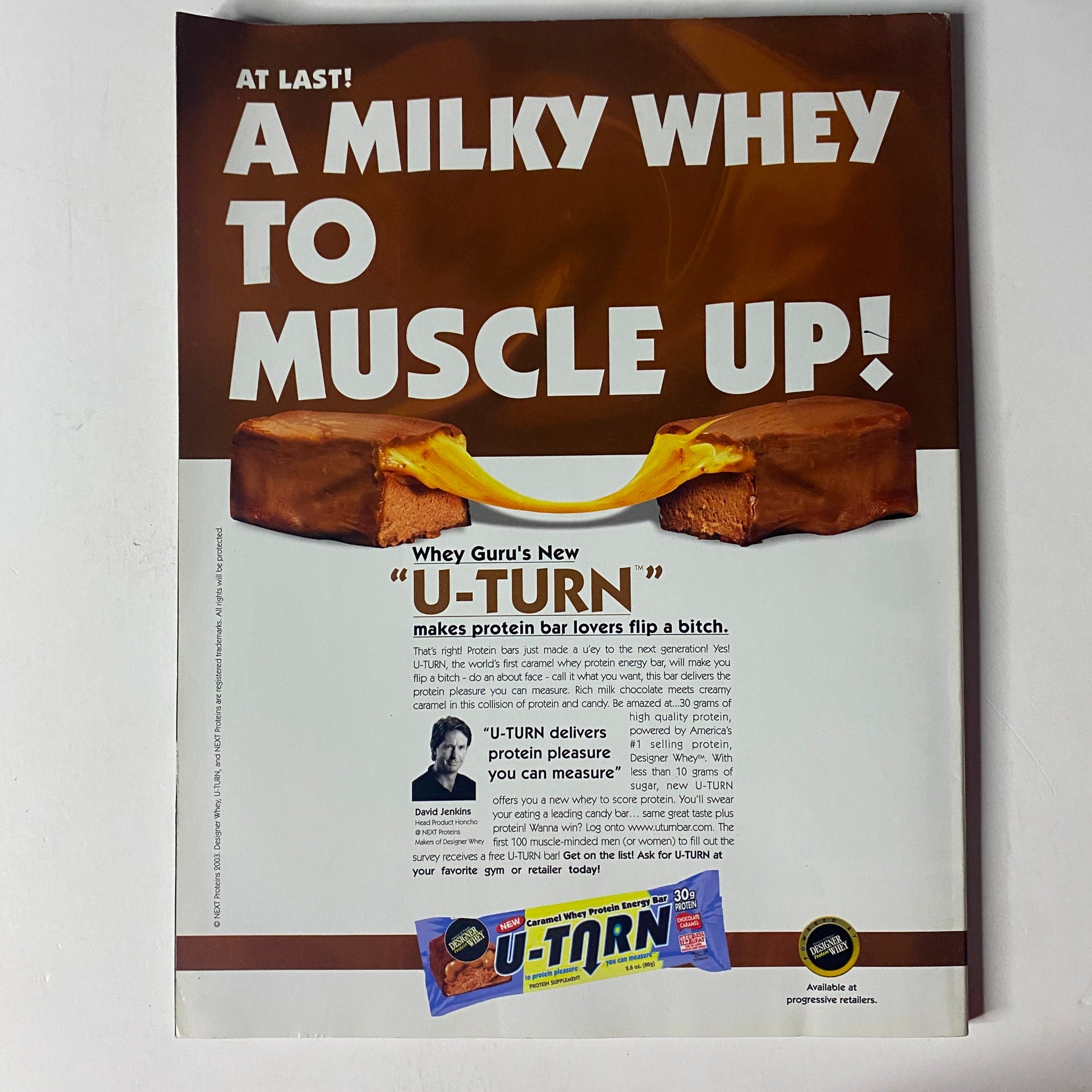 Muscle & Fitness Magazine April 2003 advertisement for 'U-TURN' protein bars, highlighting their benefits for fitness enthusiasts and protein lovers.