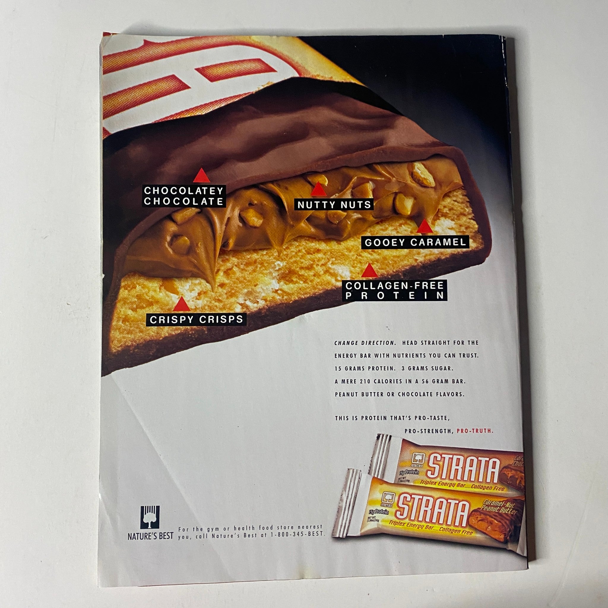 Back cover of Muscle & Fitness Magazine July 2003 Vol 64 No. 7, showcasing Nature's Best Strata protein bar with various flavors including Chocolatey Chocolate, Nutty Nuts, Gooey Caramel, and Crispy Crisps.