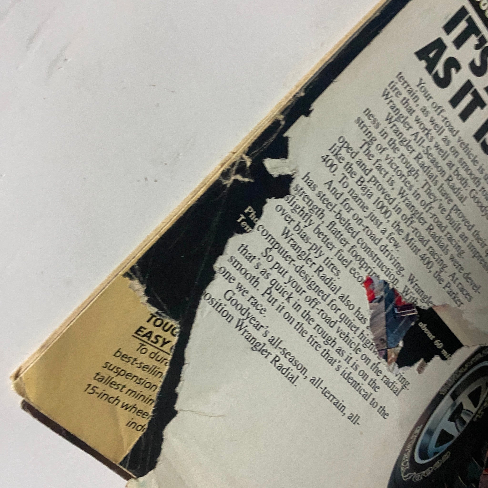 Side view of the back cover of VTG Four Wheeler Magazine May 1981 highlighting a damaged advertisement for Goodyear Wrangler Radial tires.