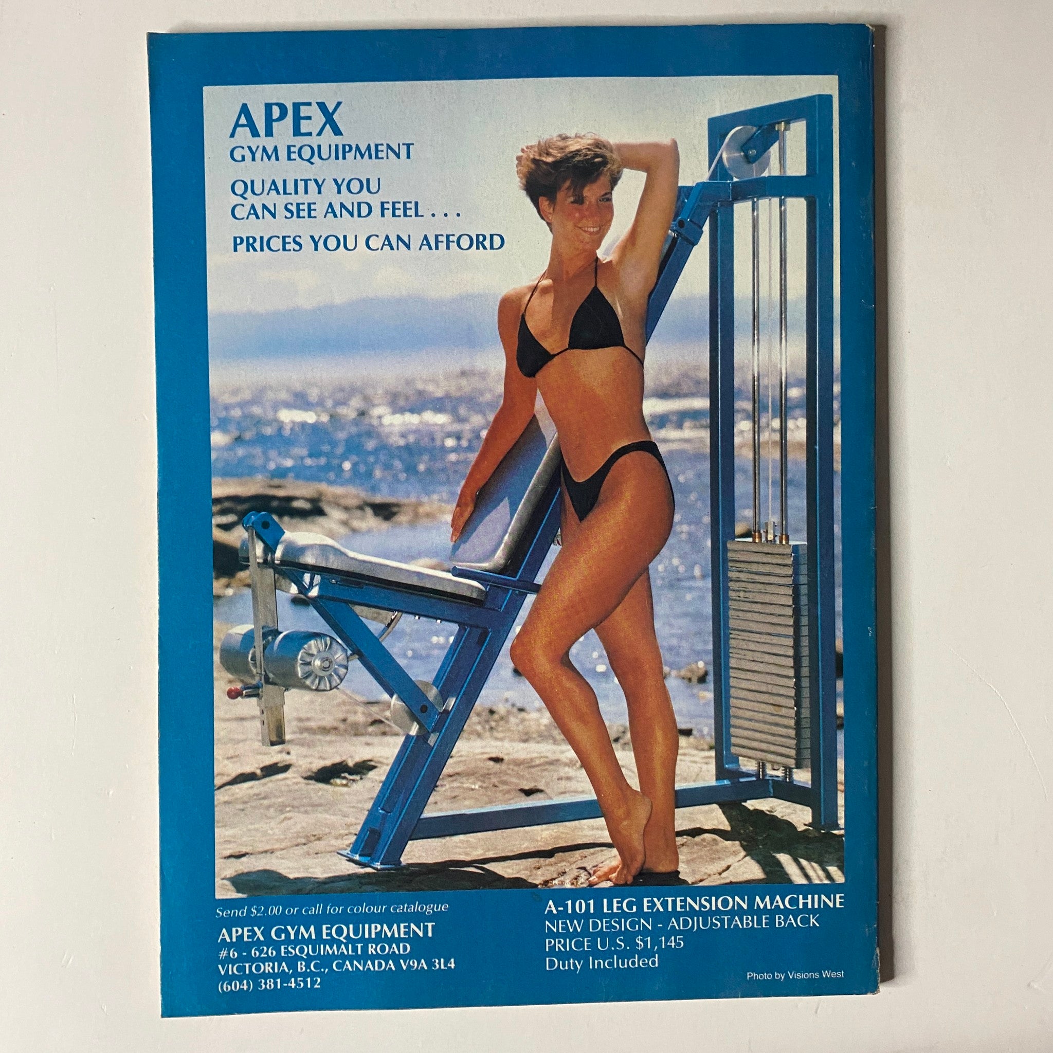 Advertisement for APEX gym equipment on the back cover of MuscleMag International Magazine, February 1989, No. 81, featuring a model next to a leg extension machine.
