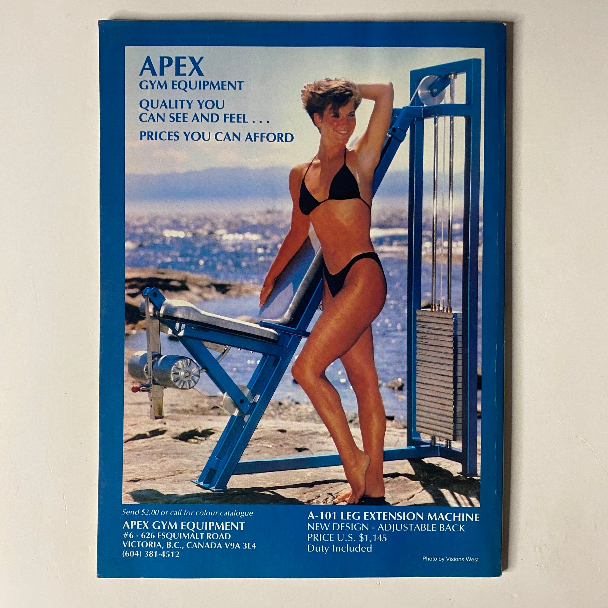 Back cover of MuscleMag International Magazine March 1989, No. 82 advertising Apex Gym Equipment with a model demonstrating the leg extension machine.