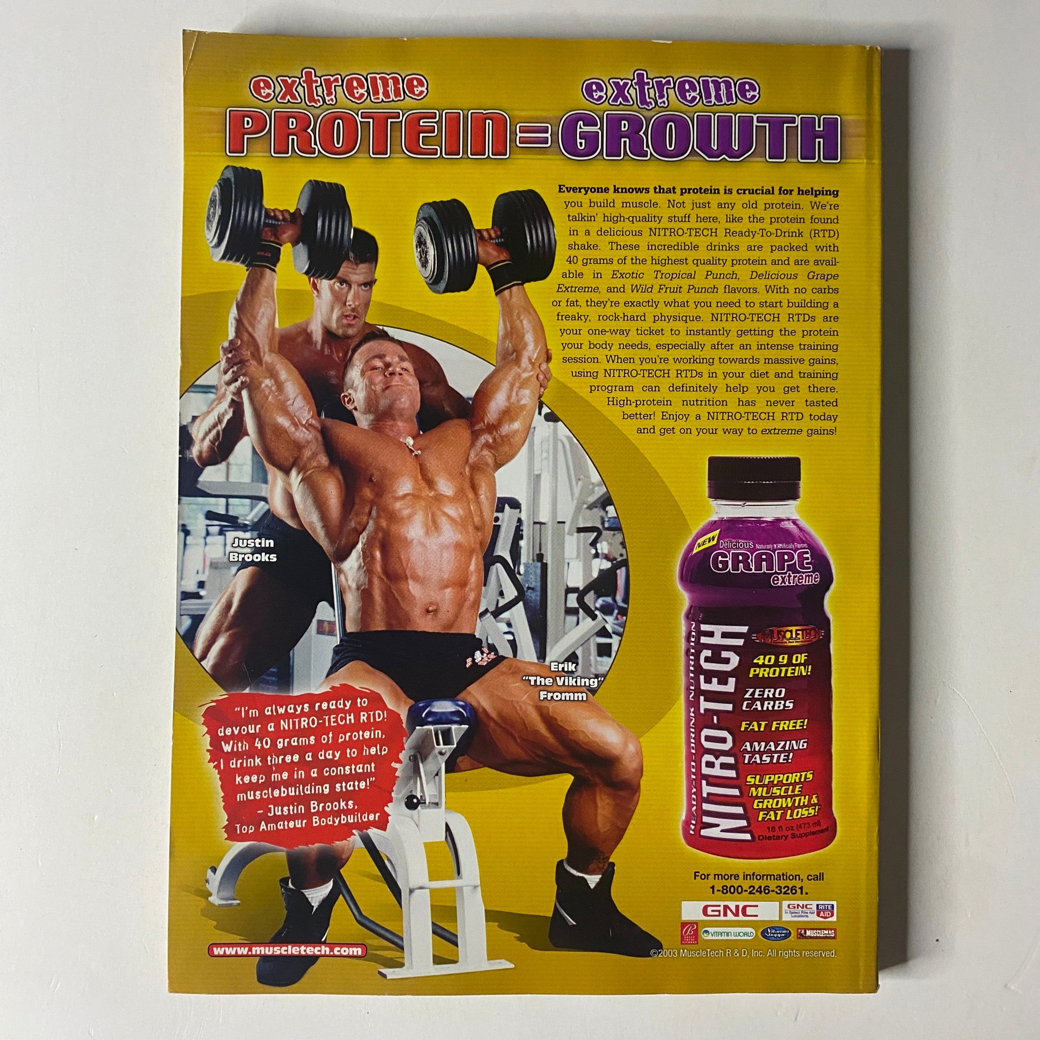 Back cover of MuscleMag International Magazine June 2003 promoting Nitro-Tech protein drink, showcasing a muscular bodybuilder performing an overhead weight exercise indicating the importance of protein for muscle growth.