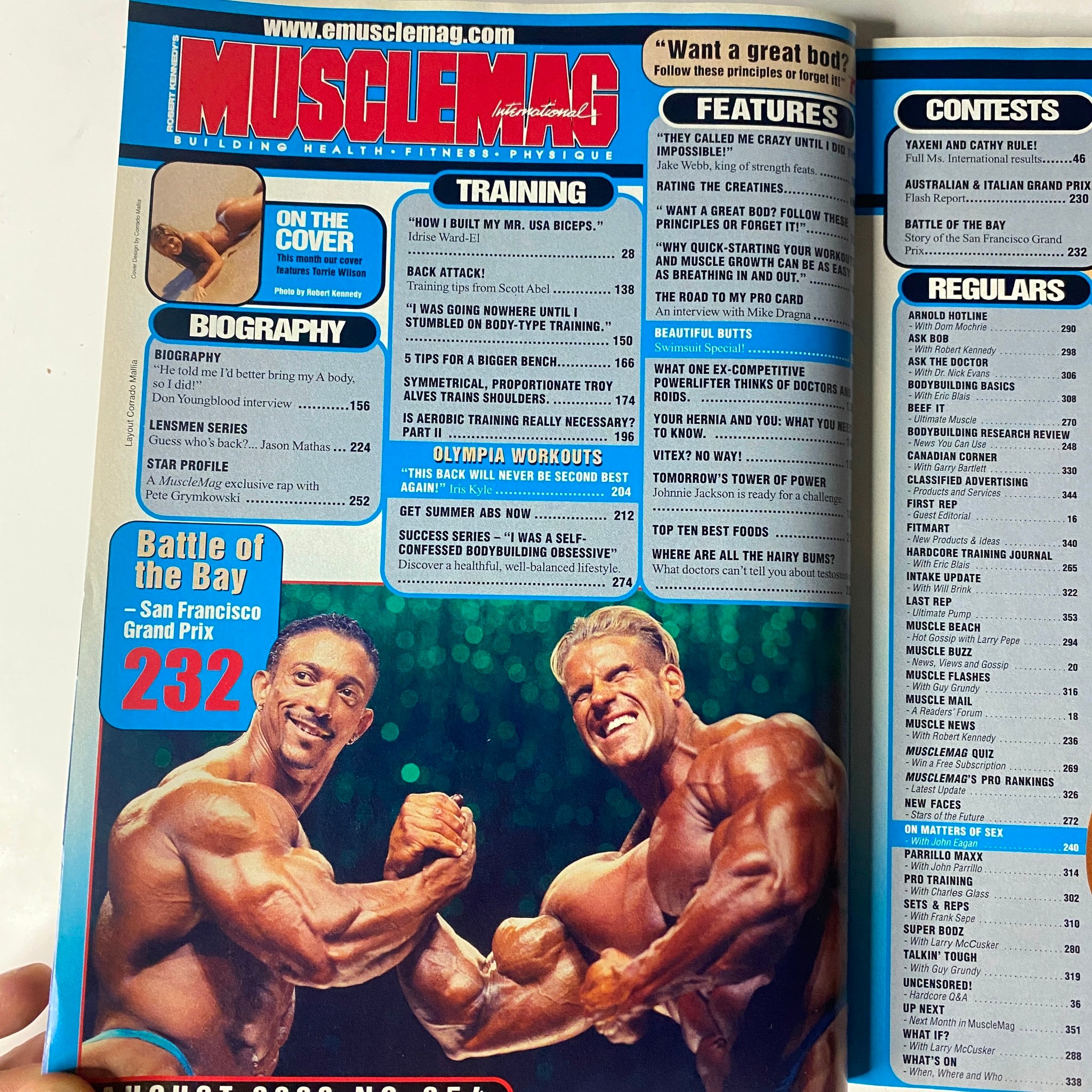 Inside page of MuscleMag International Magazine August 2003, showcasing a biography and training features, reflecting on the issue’s focus on bodybuilding.