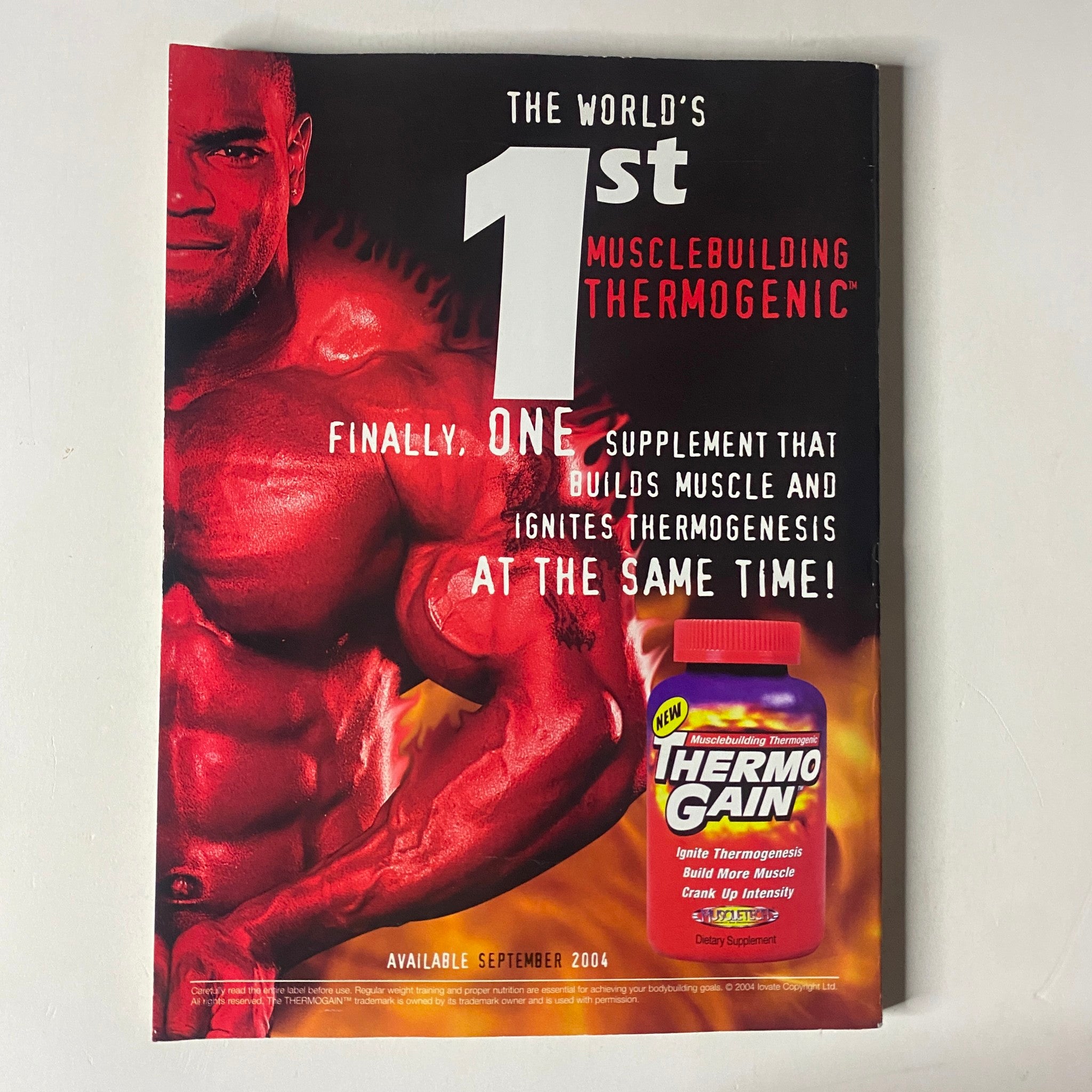Back cover of MuscleMag International Magazine December 2004 No. 270 promoting the world's first musclebuilding thermogenic supplement, Thermo Gain.
