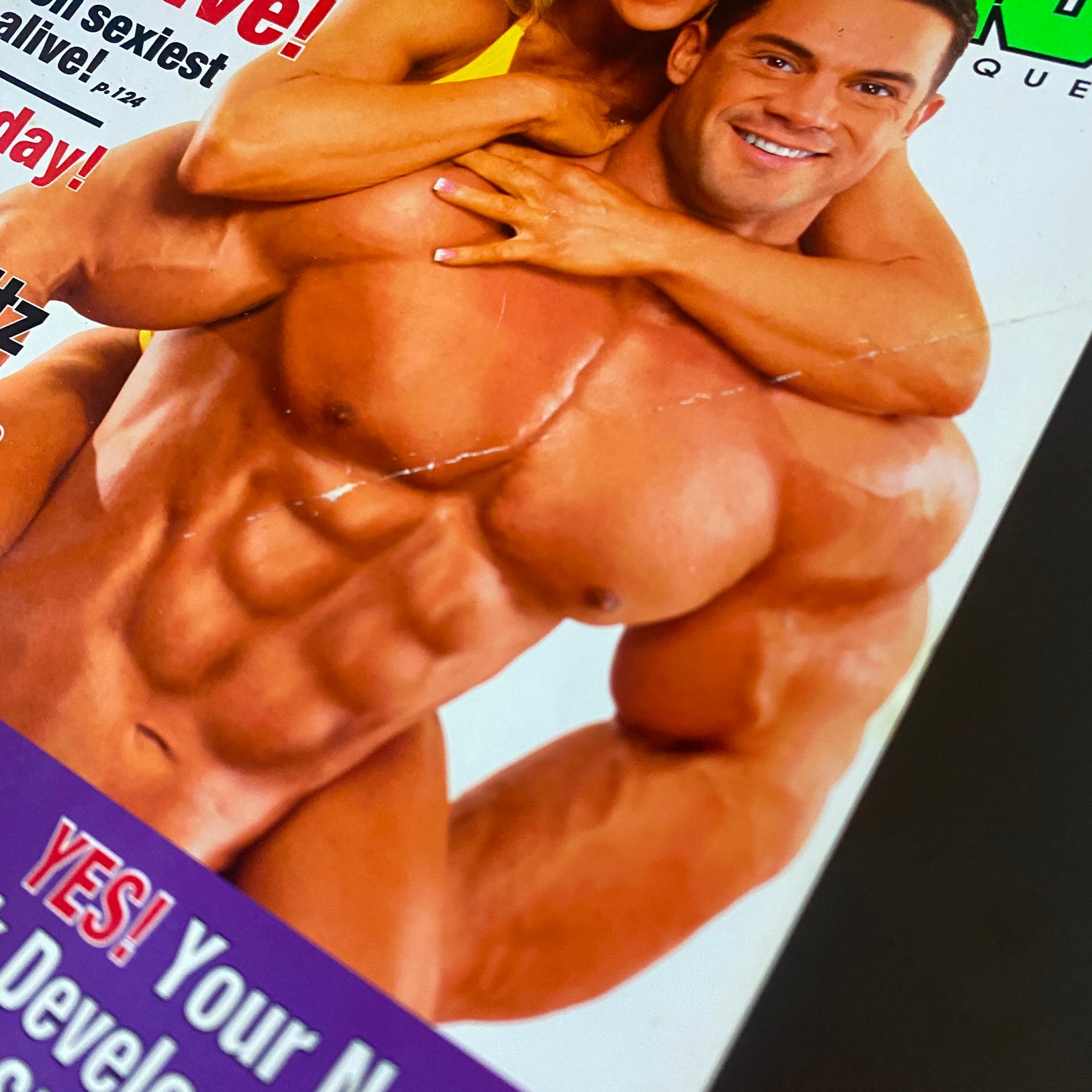 Close-up of the cover of MuscleMag International Magazine May 2005 No. 275 displaying the muscular physique of Scott Peckham with Monica Brant, emphasizing fitness and bodybuilding.