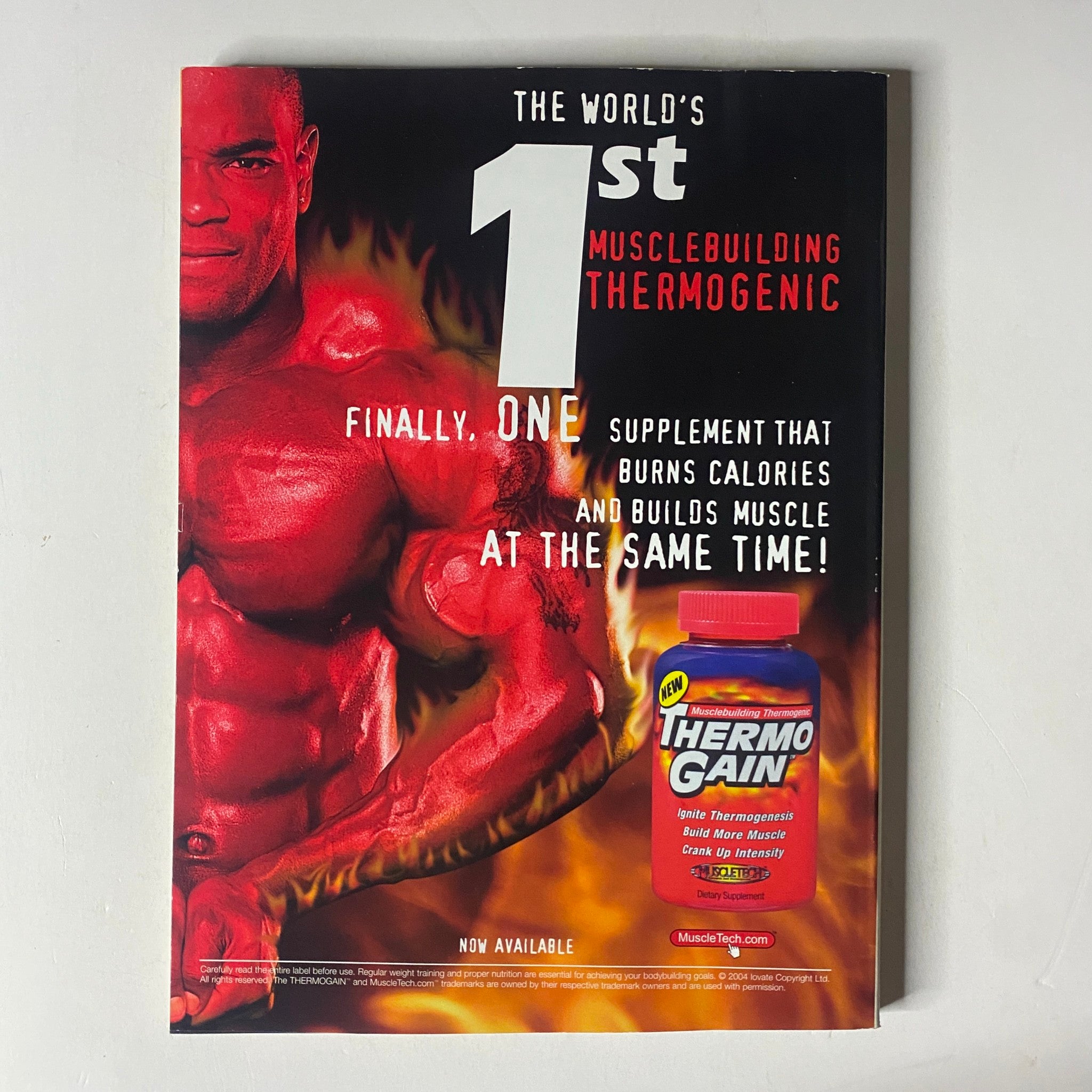 Back cover of MuscleMag International Magazine May 2005 No. 275 advertising the Thermo Gain supplement with a muscular man, promoting muscle building and calorie burning.
