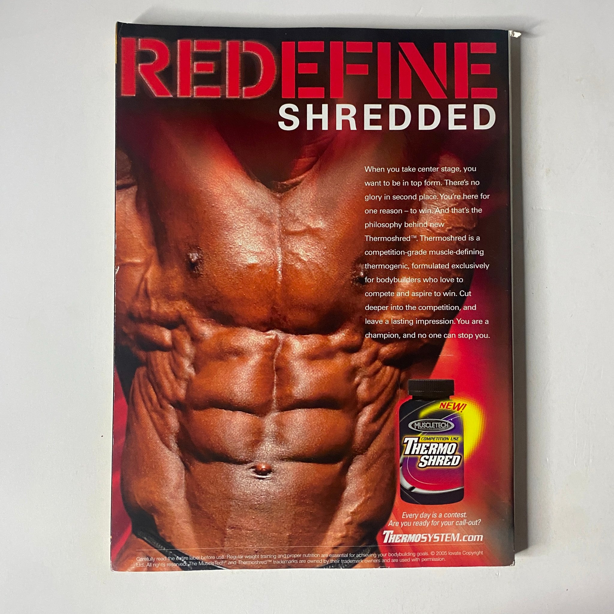MuscleMag International Magazine August 2005 featuring Robert Amstler and Federica Belli, showcasing an advertisement for ThermoShred, focusing on bodybuilding and fitness lifestyle.