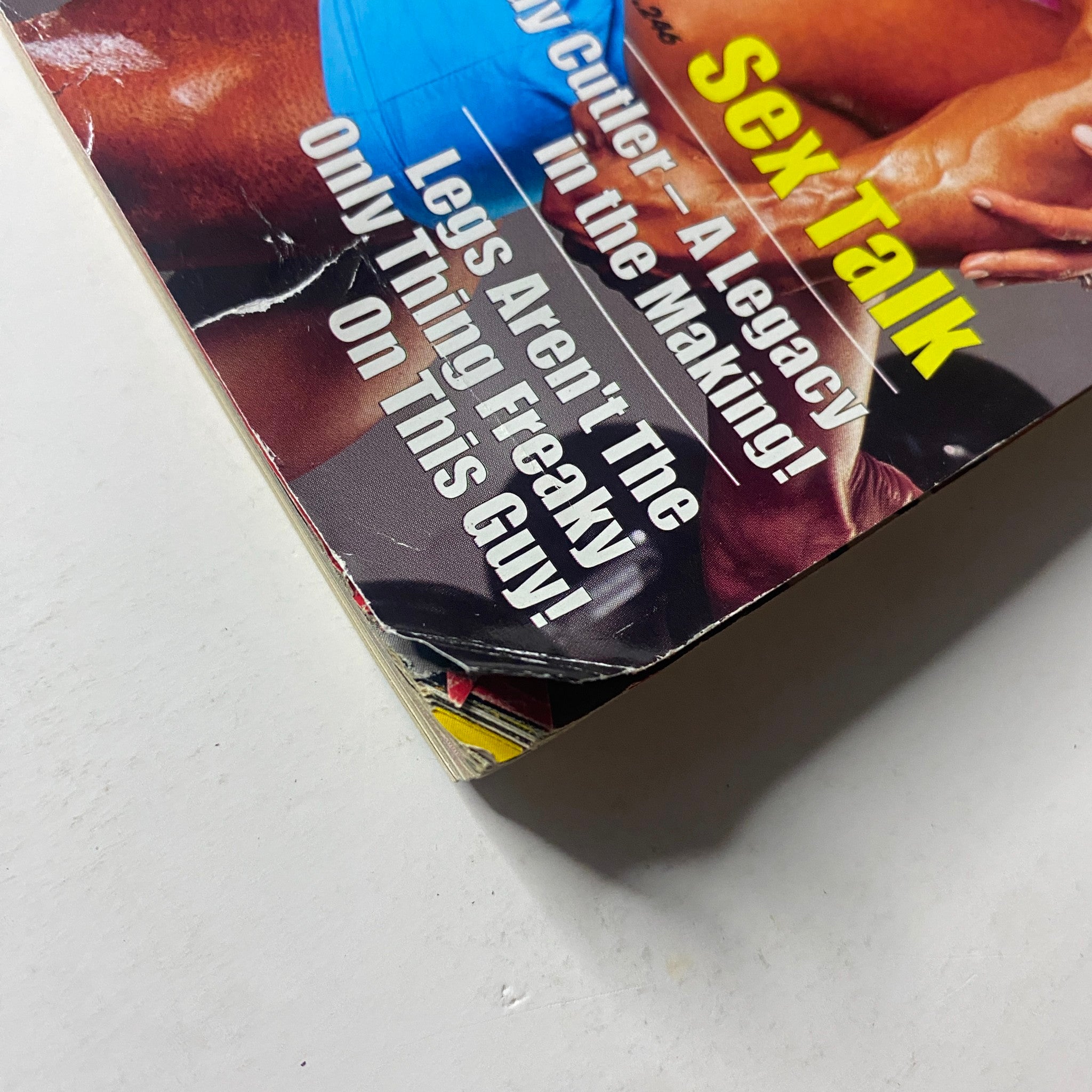MuscleMag International Magazine July 2005 showing wear on the cover featuring a headline about bodybuilding and fitness topics. This issue highlights King and Barbara Kamali.