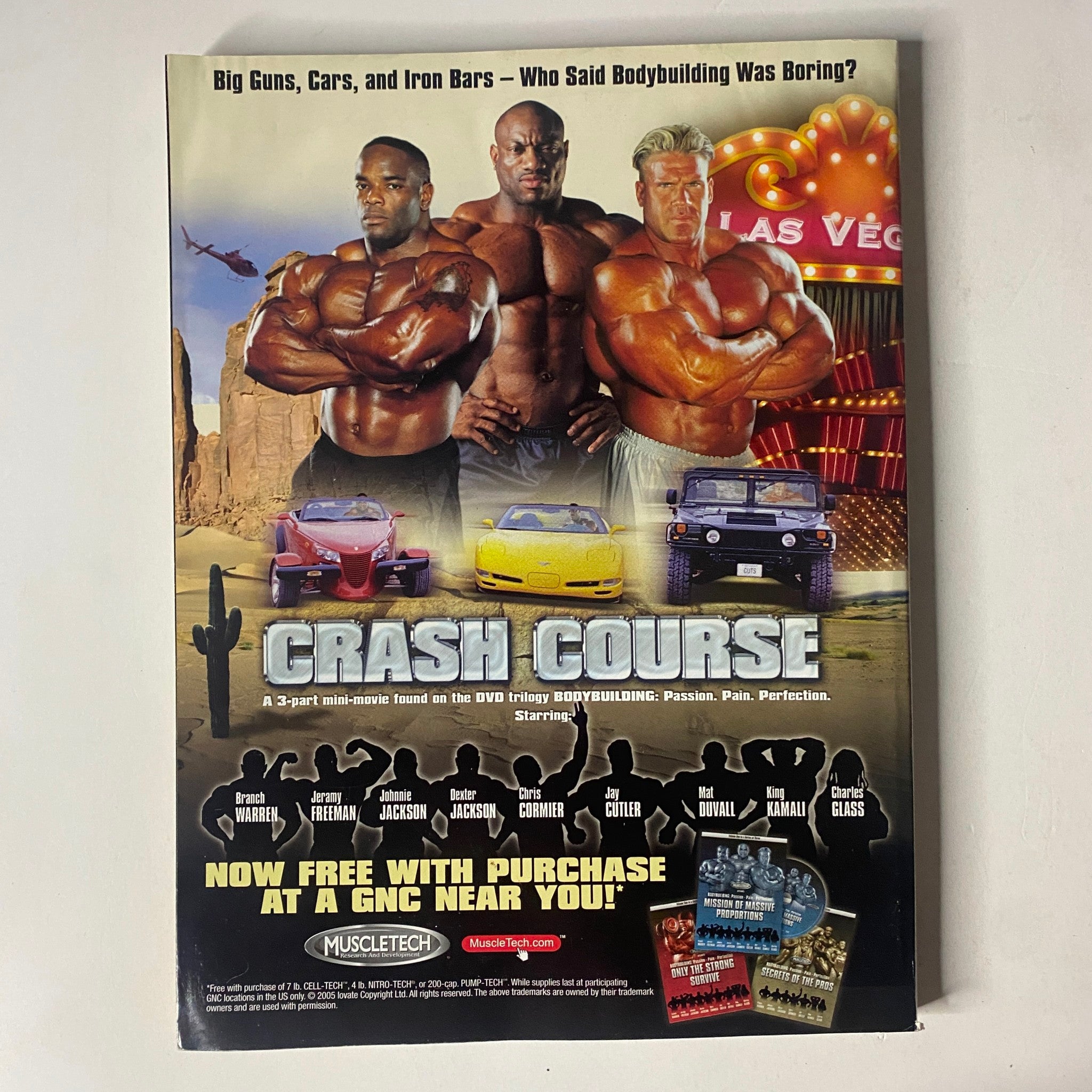 Back cover of MuscleMag International Magazine July 2005 showcasing a promotional mini-movie 'CRASH COURSE' with images of bodybuilders and a background featuring Las Vegas.