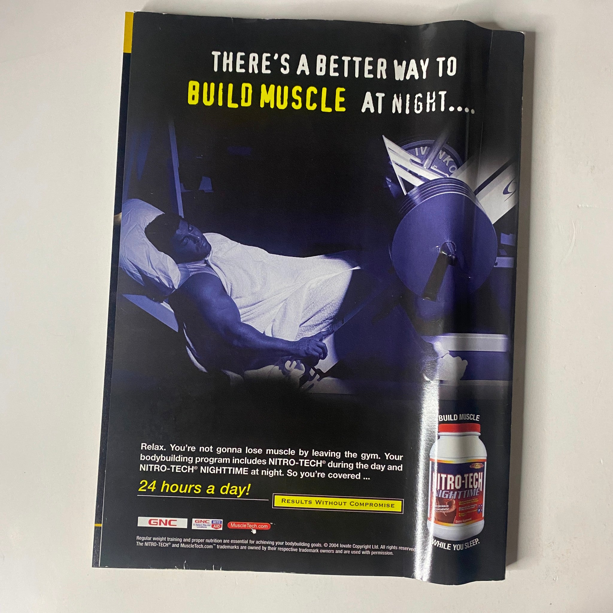 Advertisement for Nitro-Tech featuring a bodybuilder working out at night, emphasizing muscle building with the slogan 'There's a better way to build muscle at night...' from MuscleMag International Magazine March 2005 No. 273 featuring Ronnie Coleman.