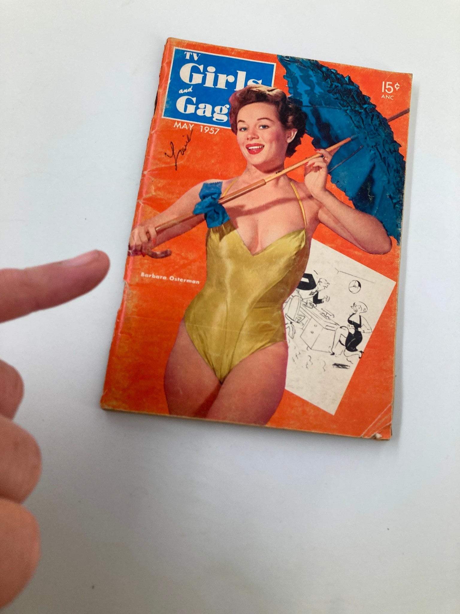 VTG TV Girls and Gags Magazine May 1957 cover with Barbara Osterman displaying a yellow swimsuit and blue umbrella, showing minor wear.