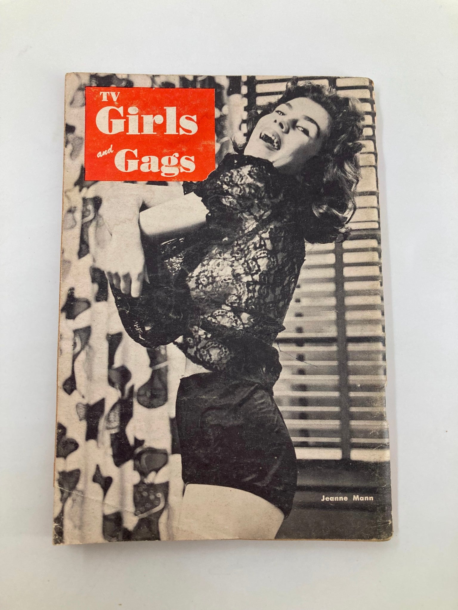 VTG TV Girls and Gags Magazine cover from May 1957 featuring Jeanne Mann in a playful pose, showcasing vintage style and design, no label.