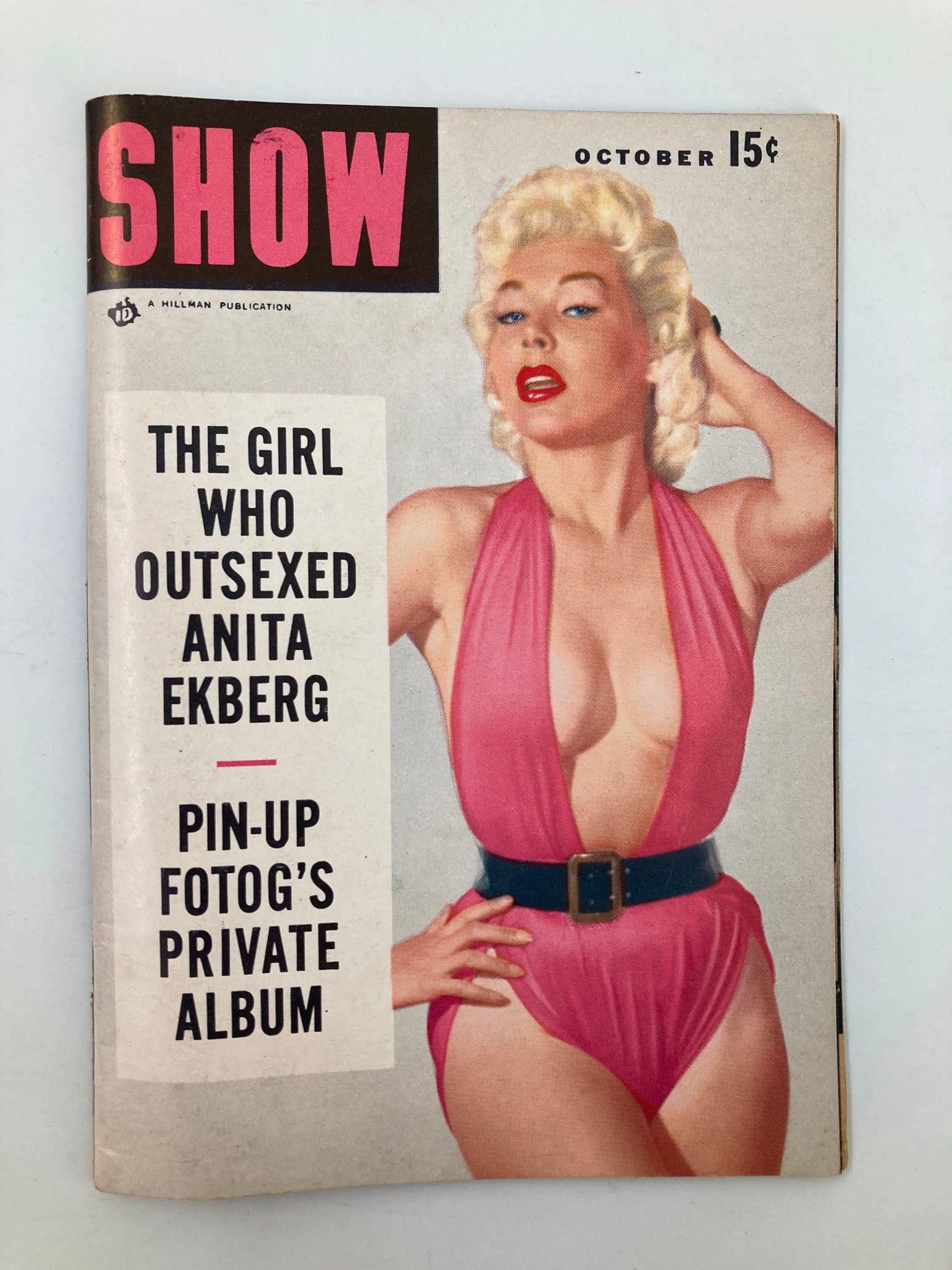 Cover page of VTG Show Magazine October featuring the title 'The Girl Who Outsexed Anita Ekberg' with a striking image of a model in a pink swimsuit, highlighting vintage fashion and Hollywood glamour.