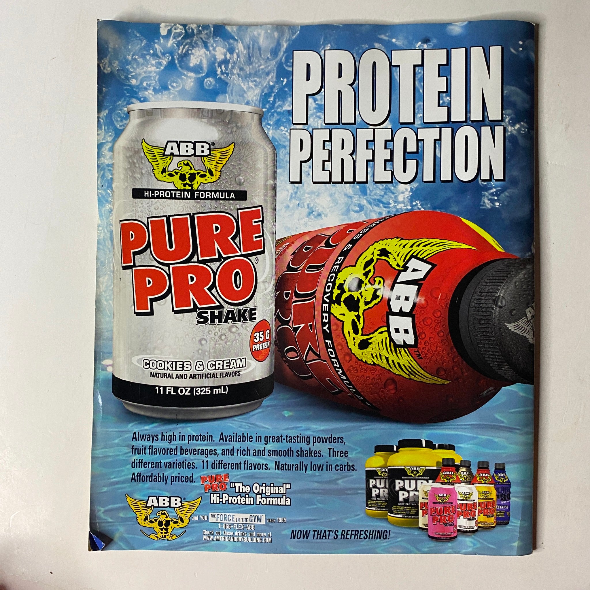 Advertisement for ABB Hi-Protein Formula Pure Pro Shake featured in Muscle & Fitness Magazine May 2005 Build a Beach Body Special Issue, promoting high-protein beverages.