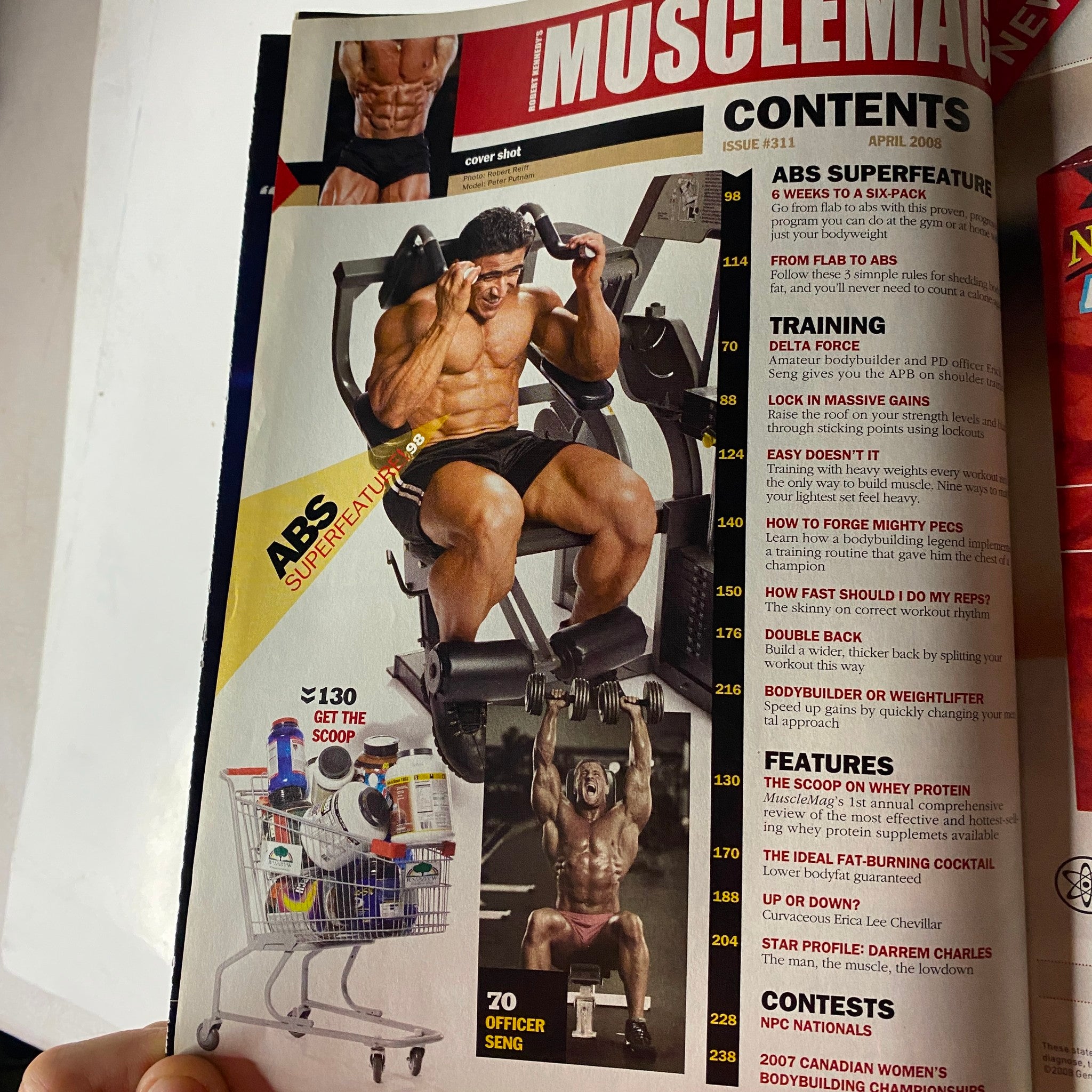 Cover image of MuscleMag International Magazine April 2008 Issue #311, featuring fitness models showcasing strength training exercises and bodybuilding techniques.