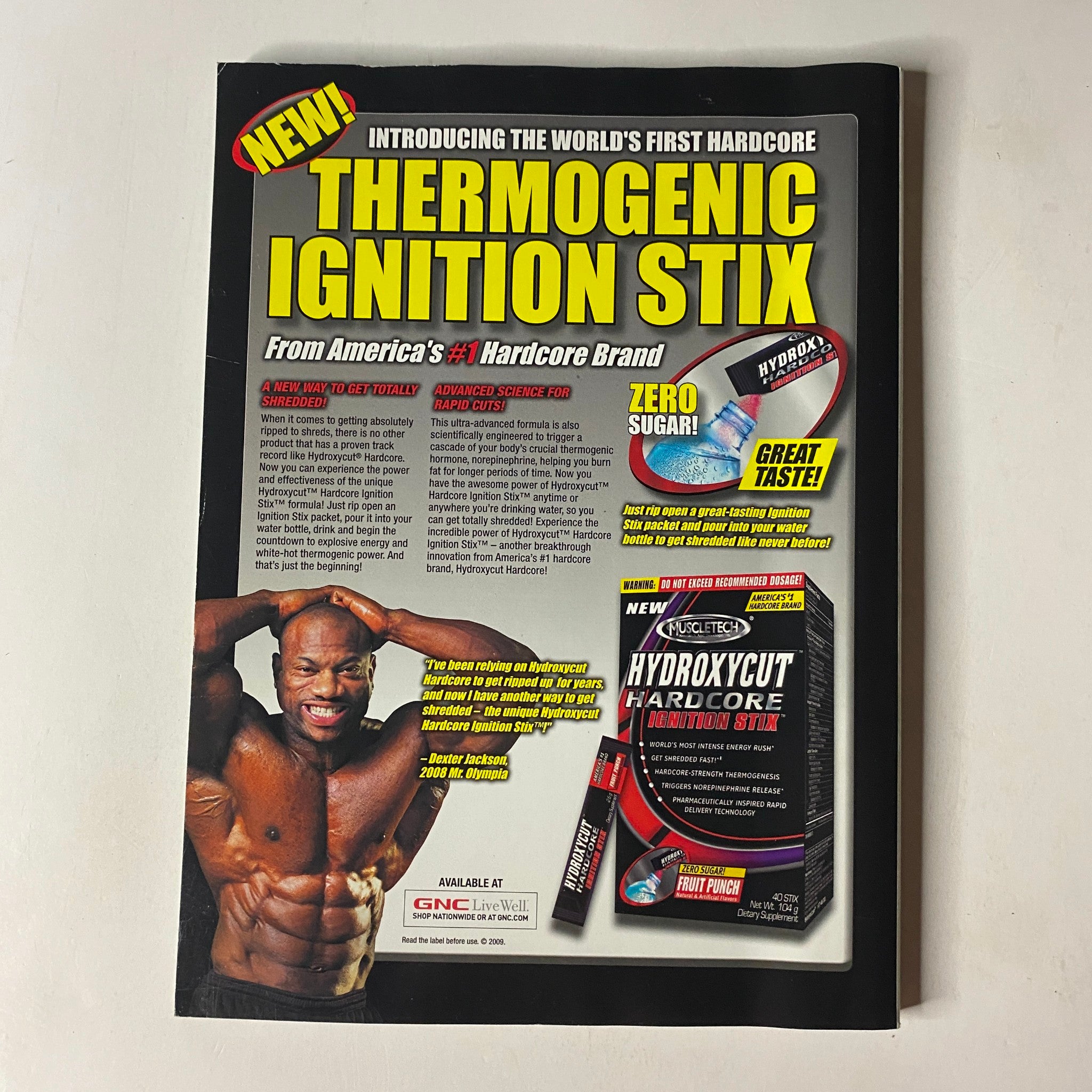 MuscleMag International Magazine July 2009, Issue No. 326 introduces 'Thermogenic Ignition Stix' advertisement, promoting a weight-loss supplement with a testimonial from bodybuilder Javier C. and highlighting zero sugar and great taste.