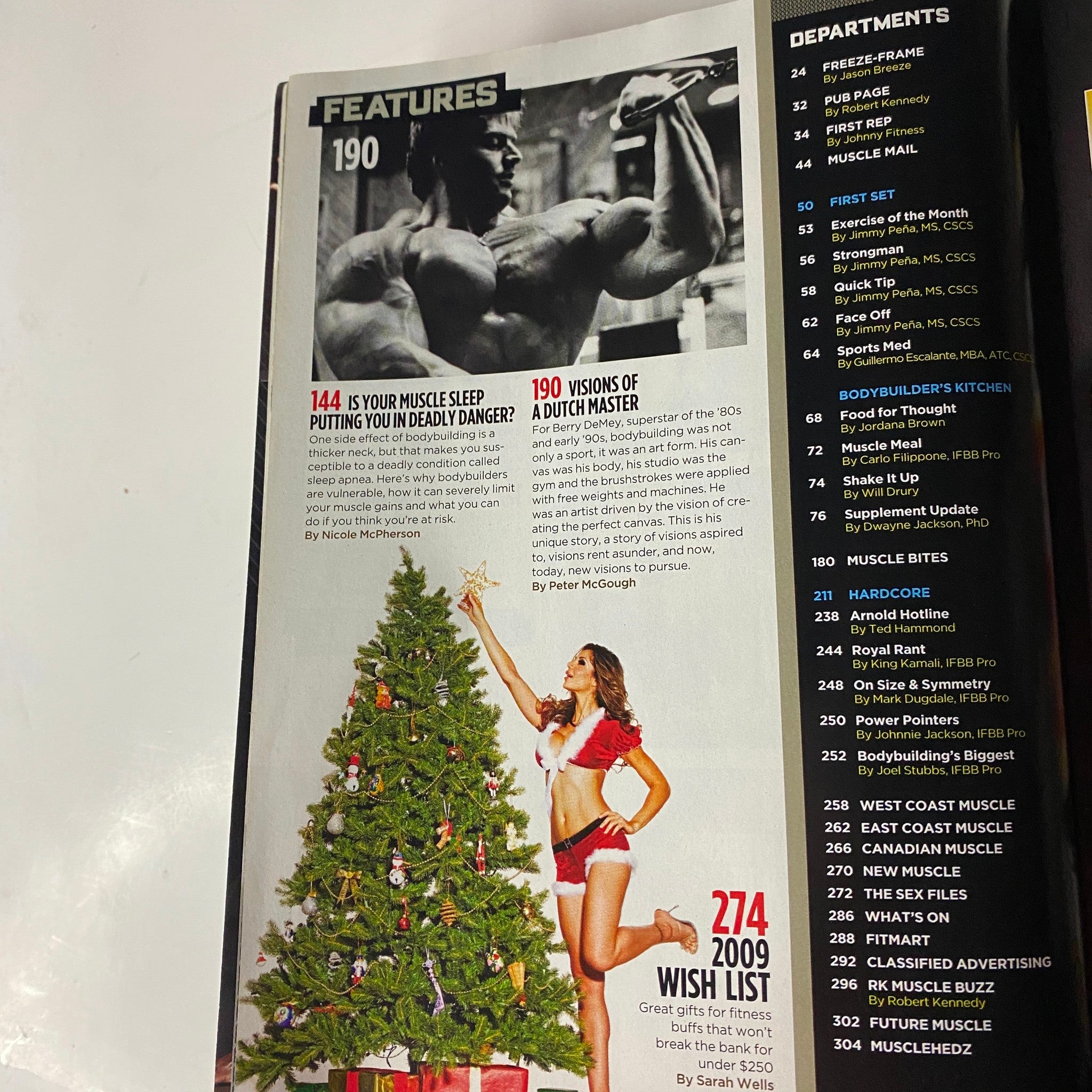 An interior page from MuscleMag International Magazine December 2009, Issue #331, featuring articles on muscle health and a festive-themed visual.