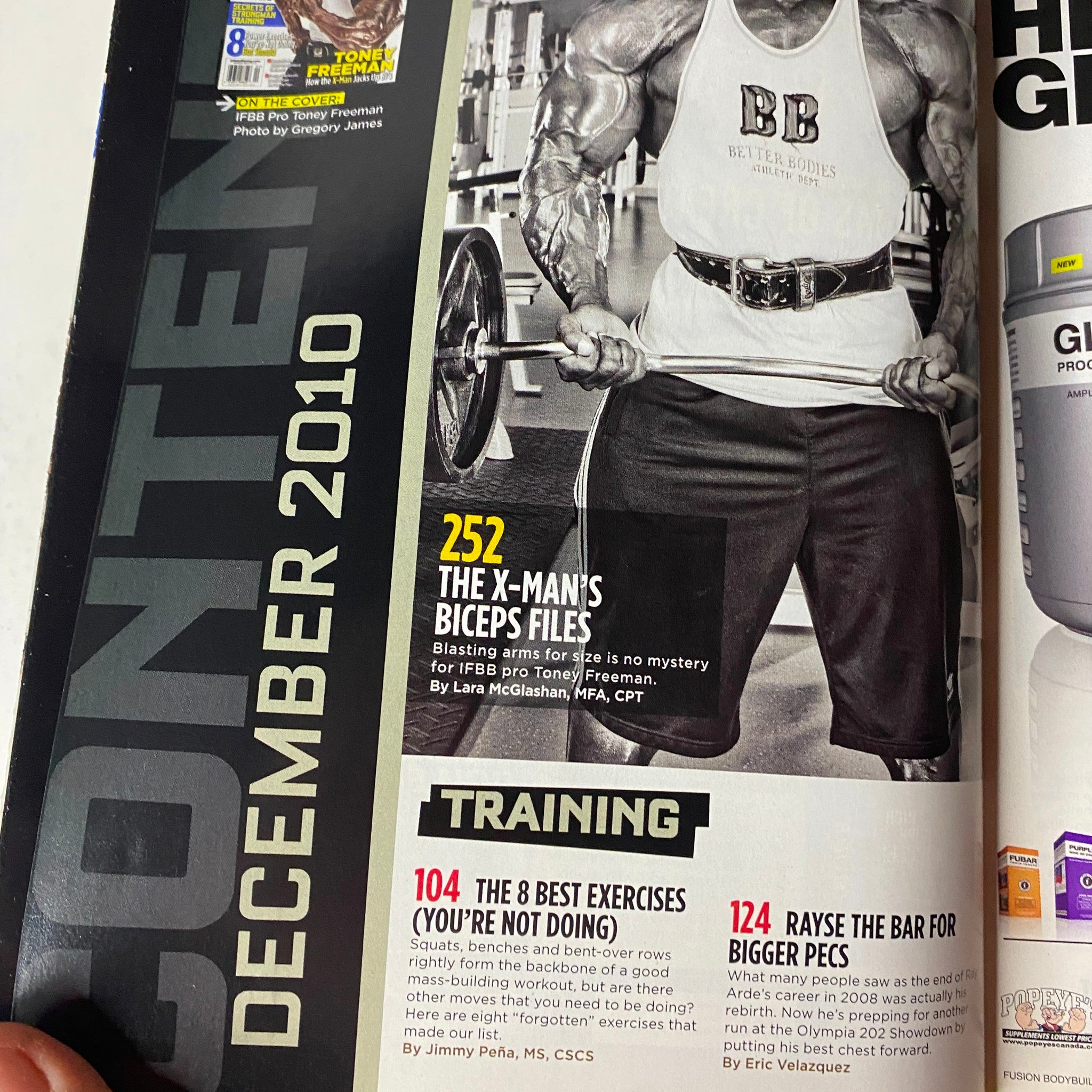 Contents page of MuscleMag International Magazine December 2010 #343, highlighting articles on Toney Freeman's bodybuilding techniques and workouts.