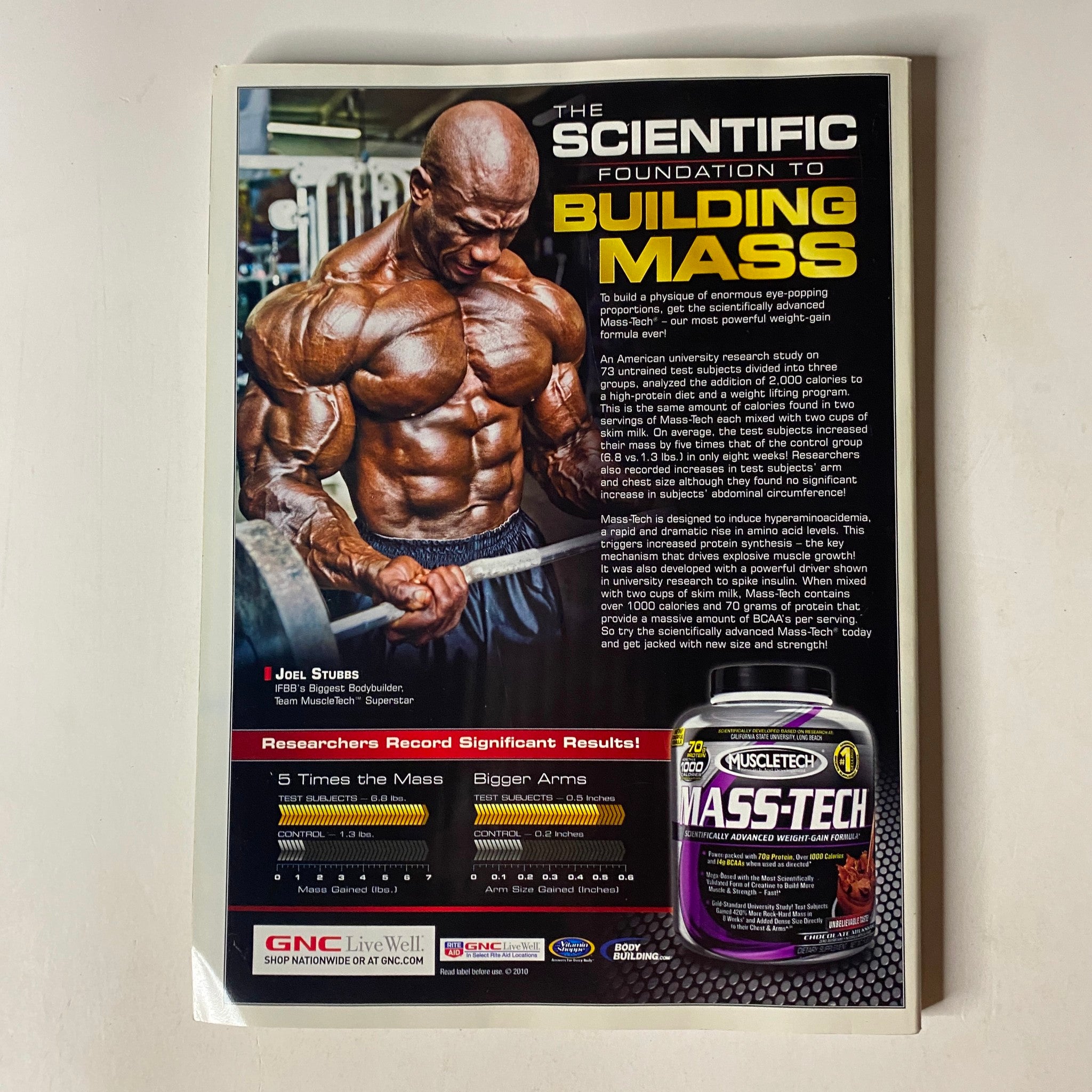 Advertisement from MuscleMag International Magazine December 2010 #343 promoting MuscleTech's Mass-Tech supplement, emphasizing bodybuilding and muscle mass building.