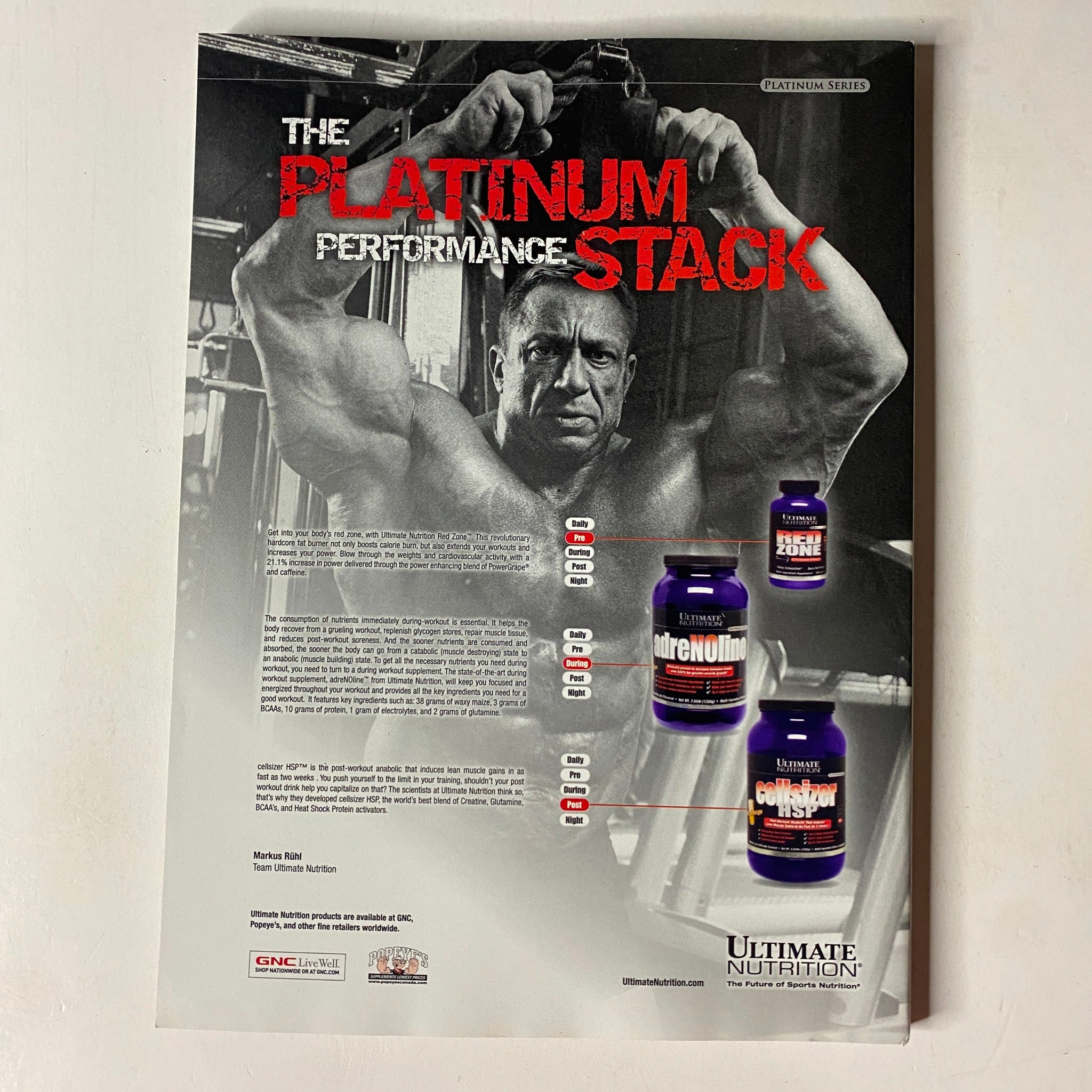 MuscleMag International Magazine February 2010 No. 333 - Advertisement for Ultimate Nutrition's Platinum Performance Stack, featuring a muscular man promoting fitness supplements.