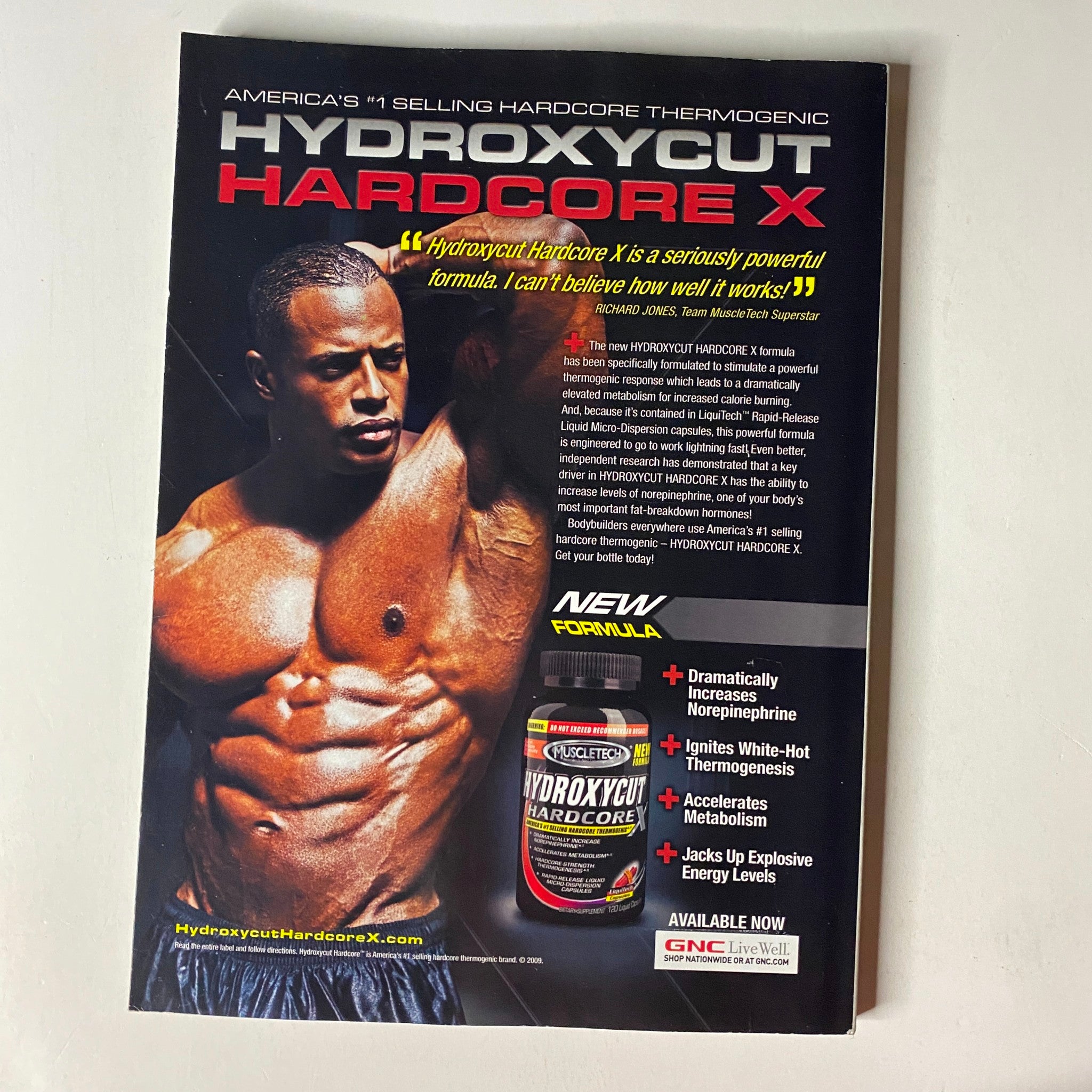 Advertisement for Hydroxycut Hardcore X featured in MuscleMag International Magazine March 2010 #334, showcasing a fit man promoting the thermogenic formula.