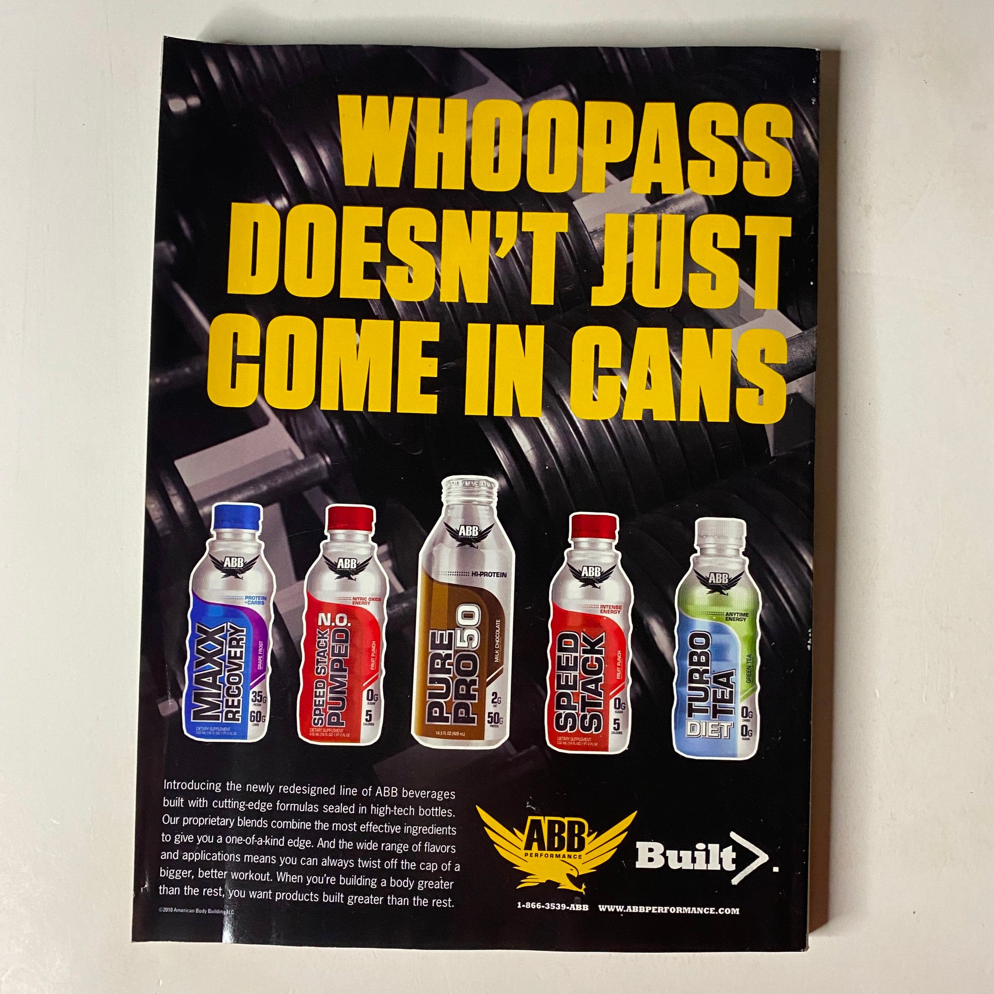 MuscleMag International Magazine April 2010 features promotional content for ABB beverage products including MAX RELOAD, PURE PRO 50, SPEED STACK, and others, emphasizing fitness and bodybuilding.