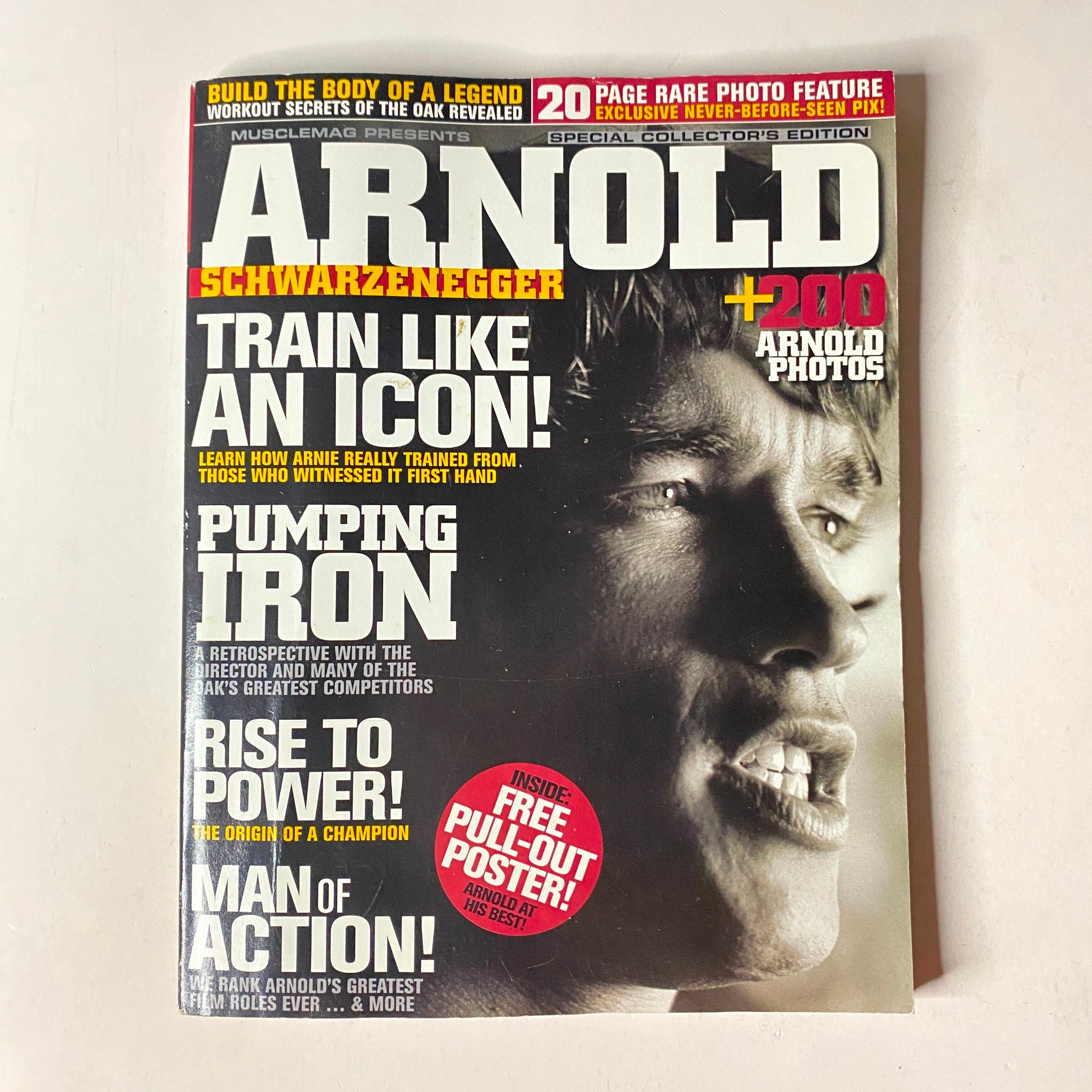 Cover of MuscleMag International Magazine Spring 2010 with Arnold Schwarzenegger, promoting a special collectors edition with a fold-out poster.