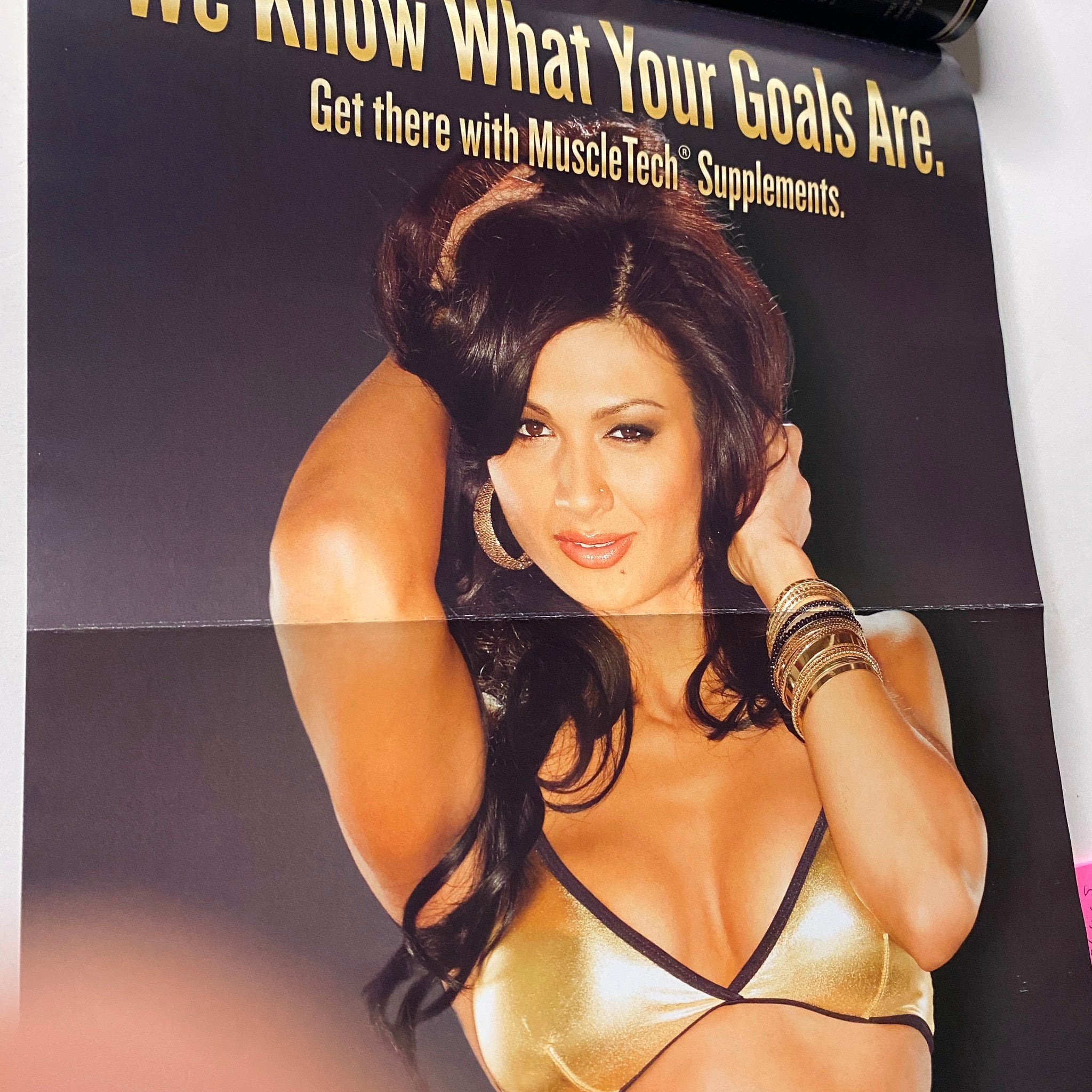 Ad showcasing a woman promoting MuscleTech supplements in MuscleMag International Magazine January 2011, No. 344.