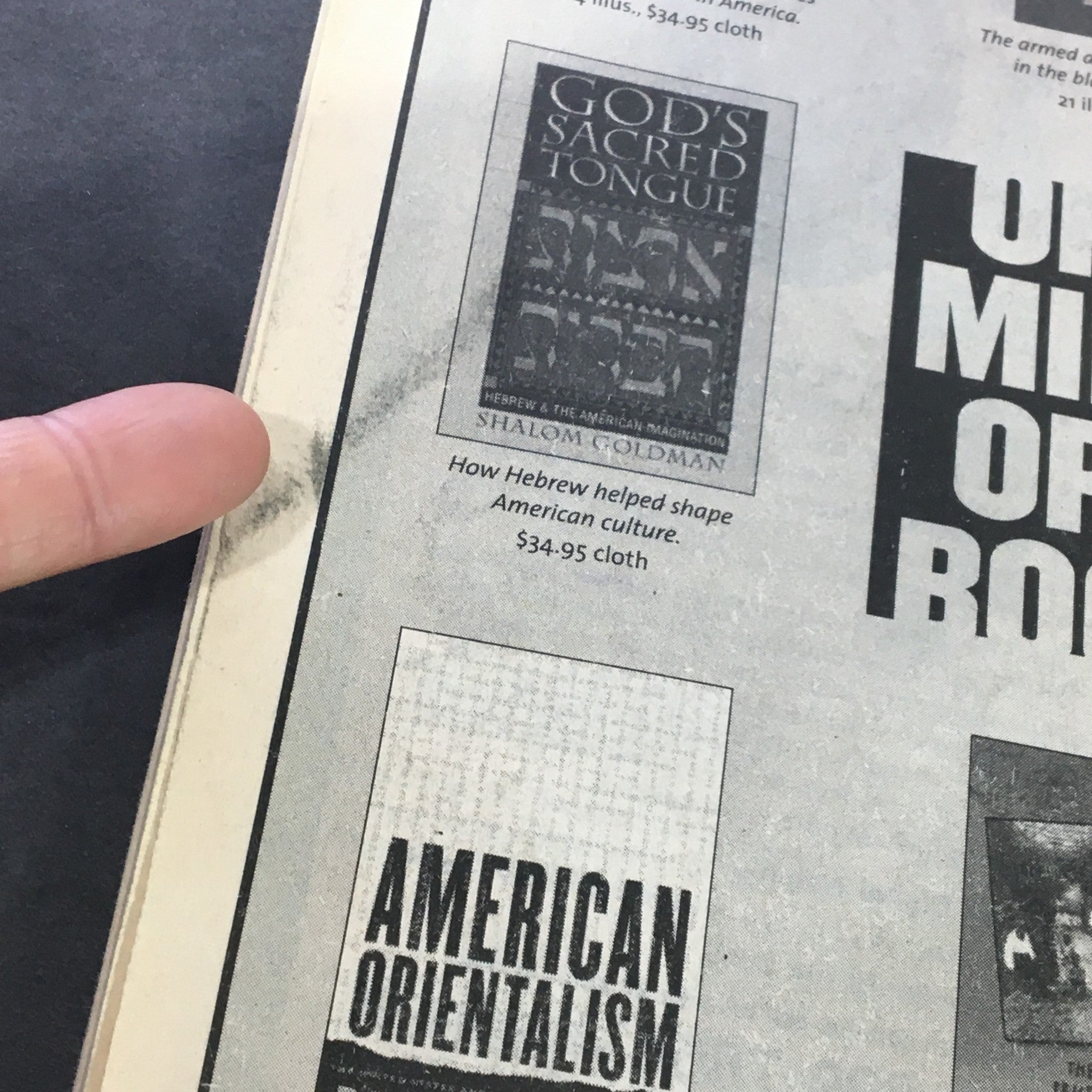 Close-up of a specific book advertisement on the back cover of The Nation Magazine dated May 17, 2004, featuring 'God's Sacred Tongue' and 'American Orientalism'.