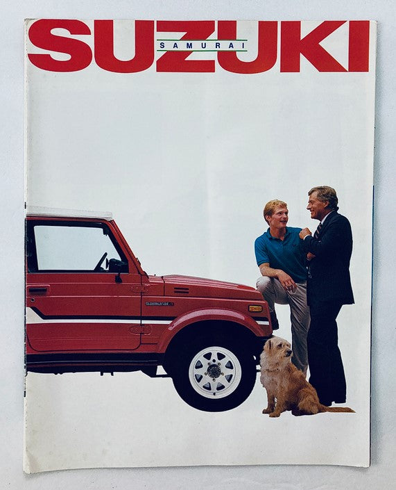 1986 Suzuki Samurai Car Dealer Showroom Sales Brochure featuring a red Suzuki Samurai vehicle, a man standing next to the car, another man, and a dog in front of the vehicle.