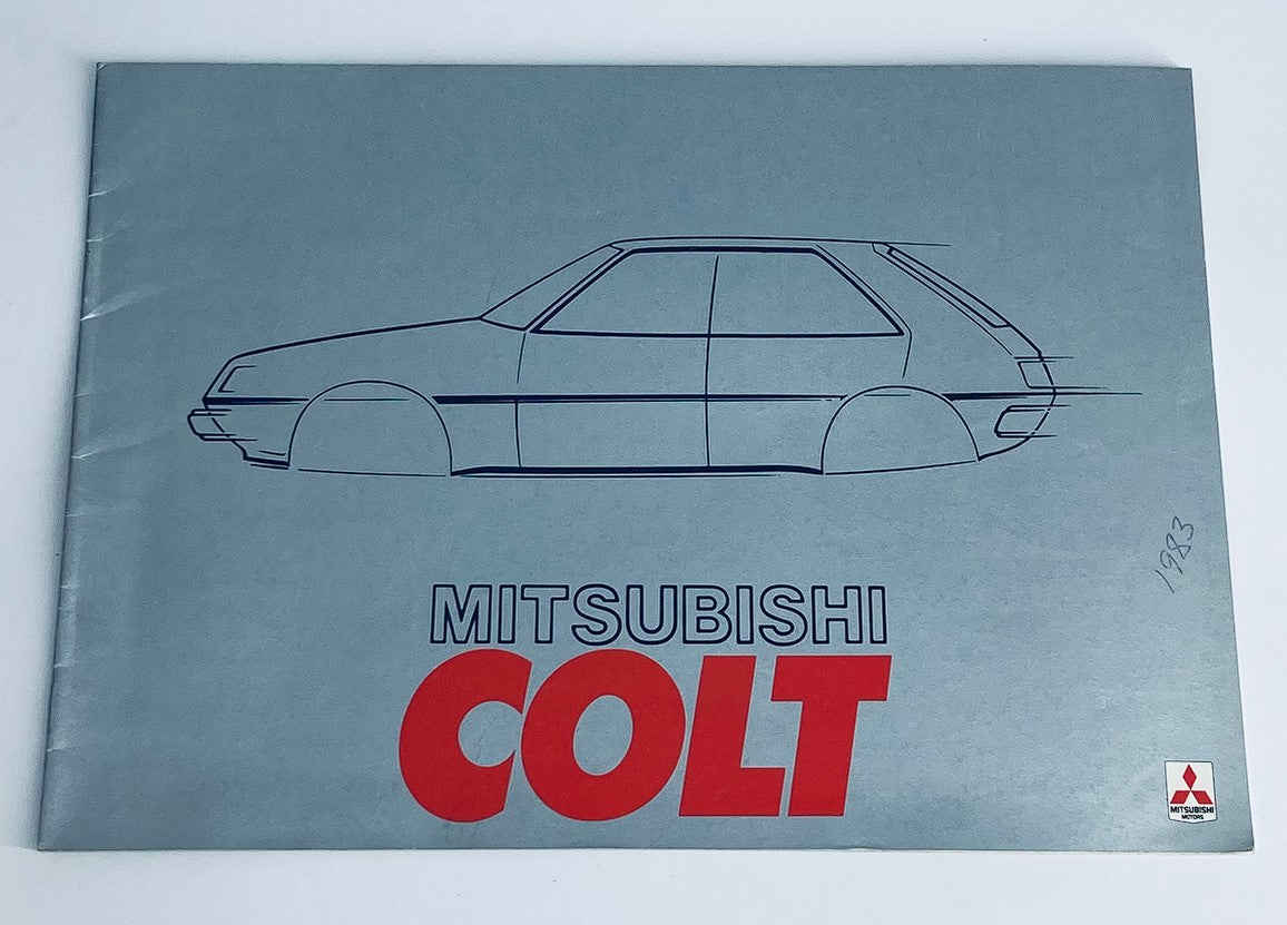 1983 Mitsubishi Colt Dealer Showroom Sales Brochure featuring the iconic design of the Mitsubishi Colt, showcasing a simple yet elegant outline of the vehicle on a blue background with bold red lettering.