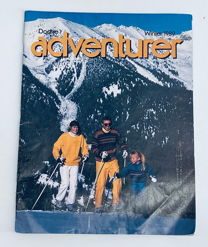 Dodge Magazine Winter 1989 cover featuring the title 'The Adventurer' with a family skiing in a snowy mountain landscape.