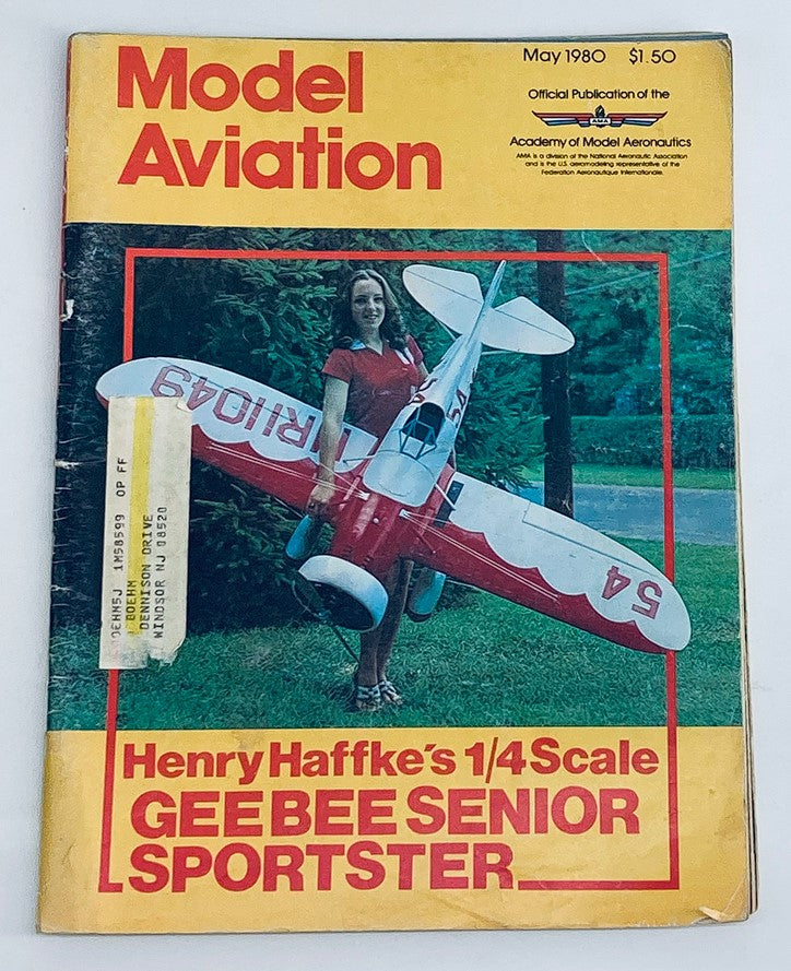 Cover of VTG Model Aviation Magazine May 1980 featuring Henry Haffke's 1/4 Scale Geebee Senior Sportster with a woman holding the model airplane.