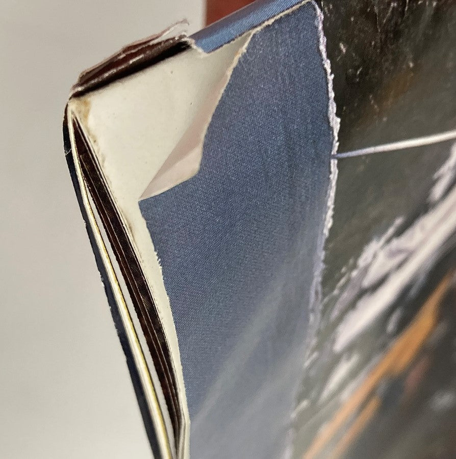 Close-up of the edge of Dodge Magazine Winter 1989, revealing wear on the cover and pages of 'The Adventurer' issue.