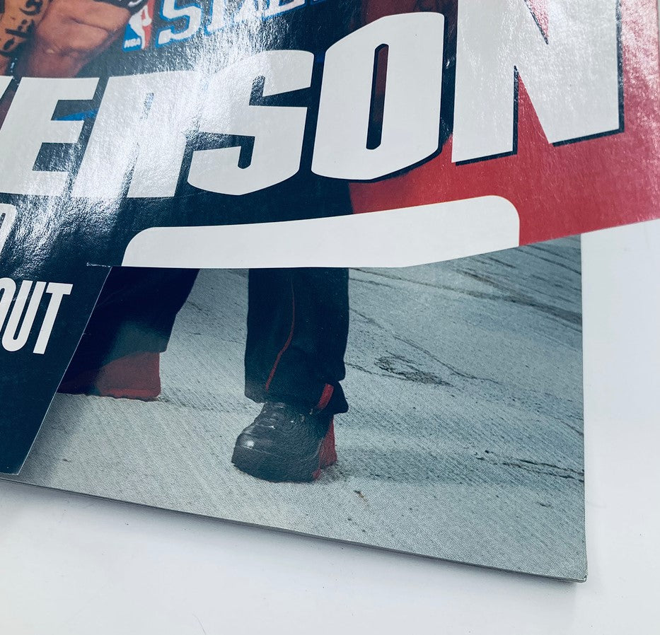 Close-up view of the cover of Slam Magazine November 2001 featuring Allen Iverson, showcasing the magazine's title and design elements.