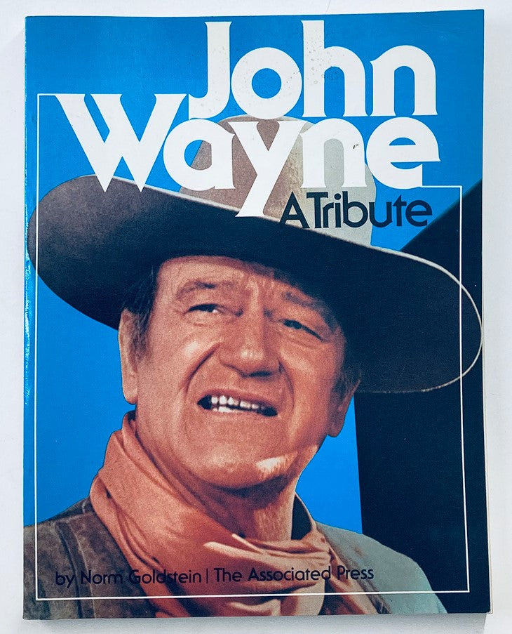 Cover of VTG 1979 John Wayne A Tribute by Norm Goldstein - The Associated Press featuring John Wayne with a cowboy hat and a warm expression.