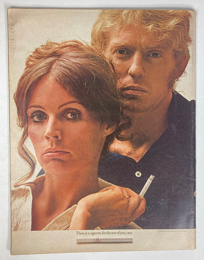 Advertisement page from Life Magazine, November 7, 1969, featuring a couple with the tagline 'There is a cigarette for the two of you.' This page highlights 1960s advertising styles.