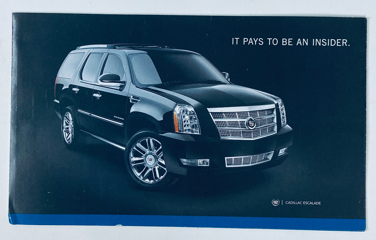 2010s Cadillac Escalade Dealer Showroom Sales Brochure featuring a black Cadillac Escalade SUV, highlighting luxury automotive design and marketing aesthetics.