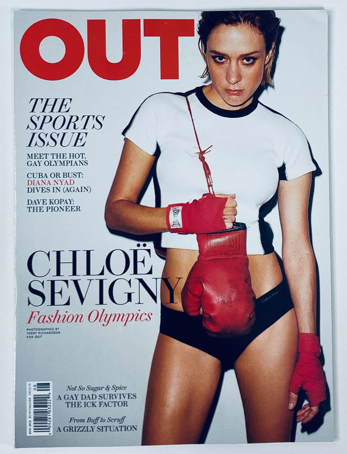 Cover of Out Magazine August 2012 featuring Chloë Sevigny in sporty attire, symbolizing fashion and contemporary culture.